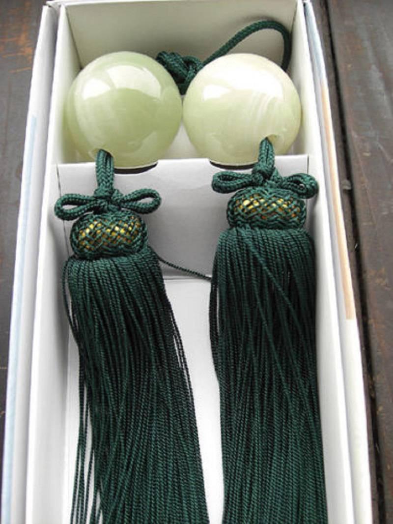 An attractive pair of handcrafted Japanese white agate fuchin or scroll weights in a lovely color and in ball form. With new quality green and gold cords. 

Dimensions: 8.5 inches length and 1.5 inches diameter

Handmade.
Beautiful colors.
We