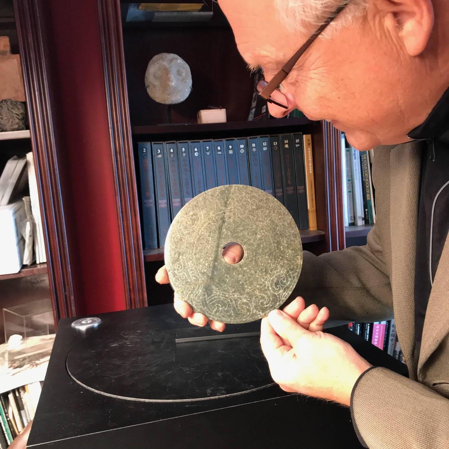 This is an authentic Chinese ancient jade bi disc from the Han dynasty (220 BC-220AD). This comes from our private ancient Chinese jade collection which was formed from twenty five years ago.

Dimensions: the bi disc is 6.5 inches diameter and .13