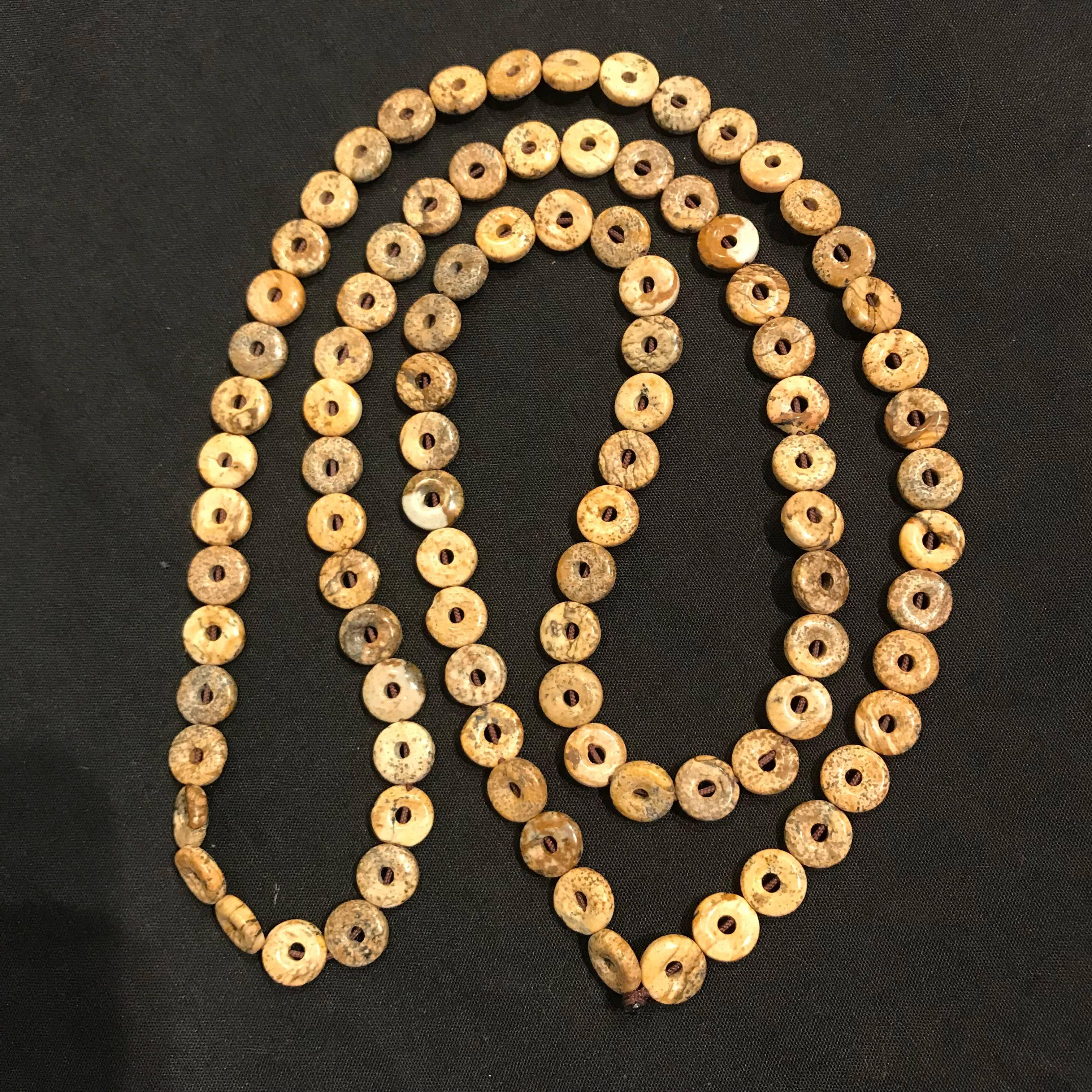 China, a fine necklace consisting of ancient Chinese jade small scale bi's -bead size- strung as a necklace, over 90 pieces.  Bi -beads- are calcified jade that have been cleaned and polished.  Please note the different colors of these bi from under