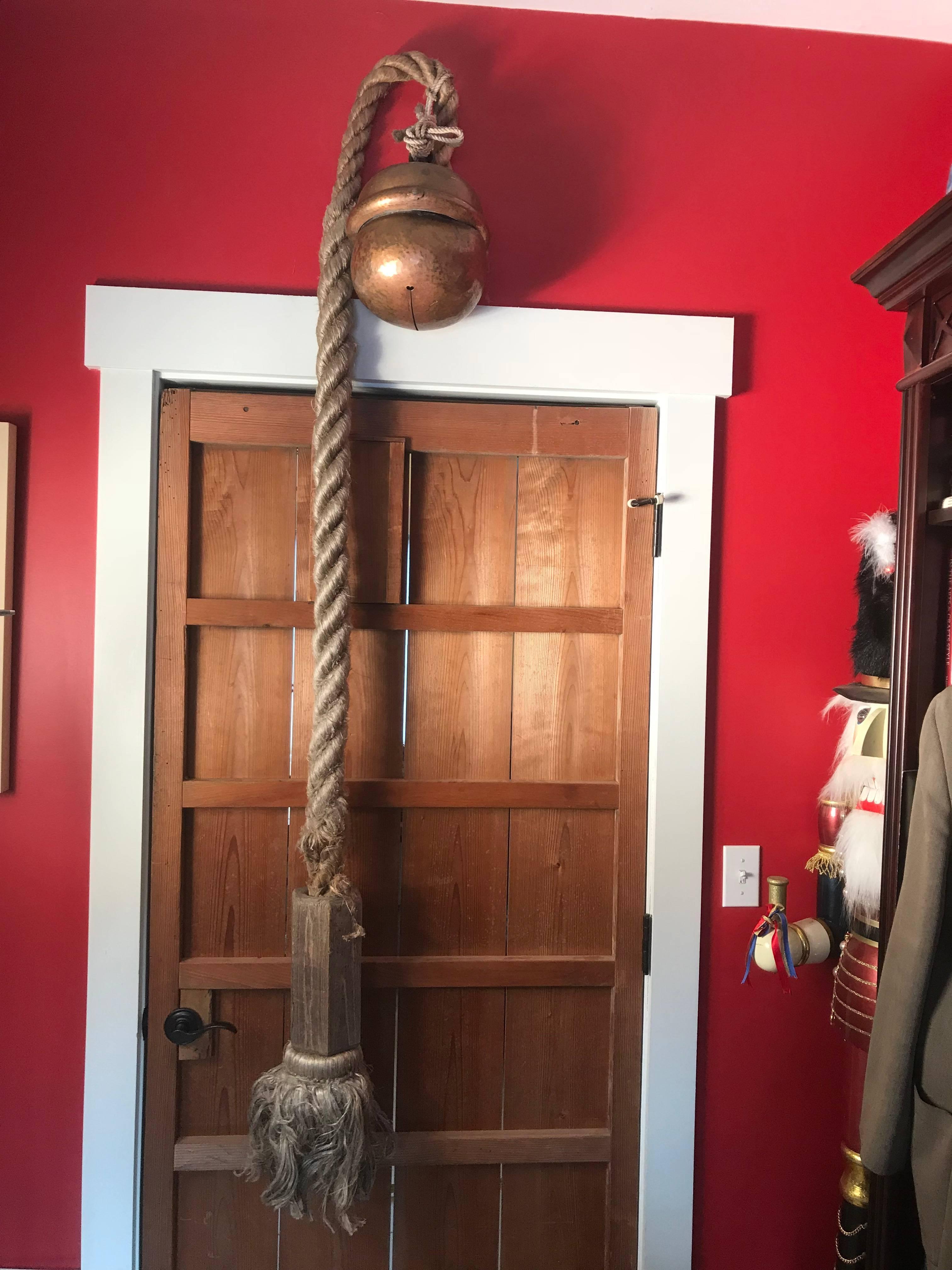 Here's an extraordinary opportunity to collect and acquire a Japanese authentic hand cast copper Shinto Suzu bell complete with its original thick pull rope and massive wooden handle. The bell is signed by its multiple original donors from the