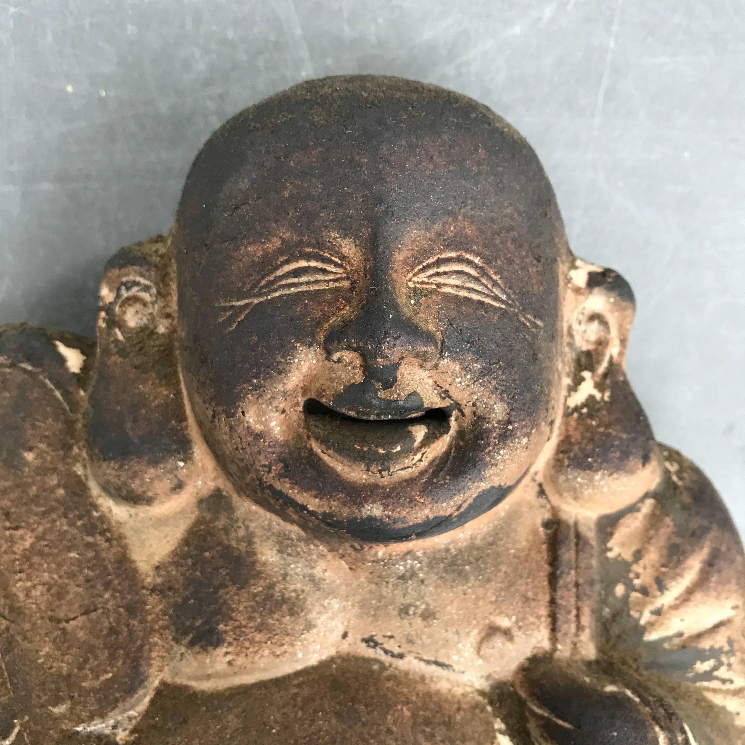 An authentic Japanese time honored Folk Art sculptural symbol, Hotai San, found in old Japan's kitchen or hearth areas, usually seen on the top of the Mizuya Dansu- Kitchen Chest. 
 
He is a jolly protector of sacred areas in our homes.

Dimensions: