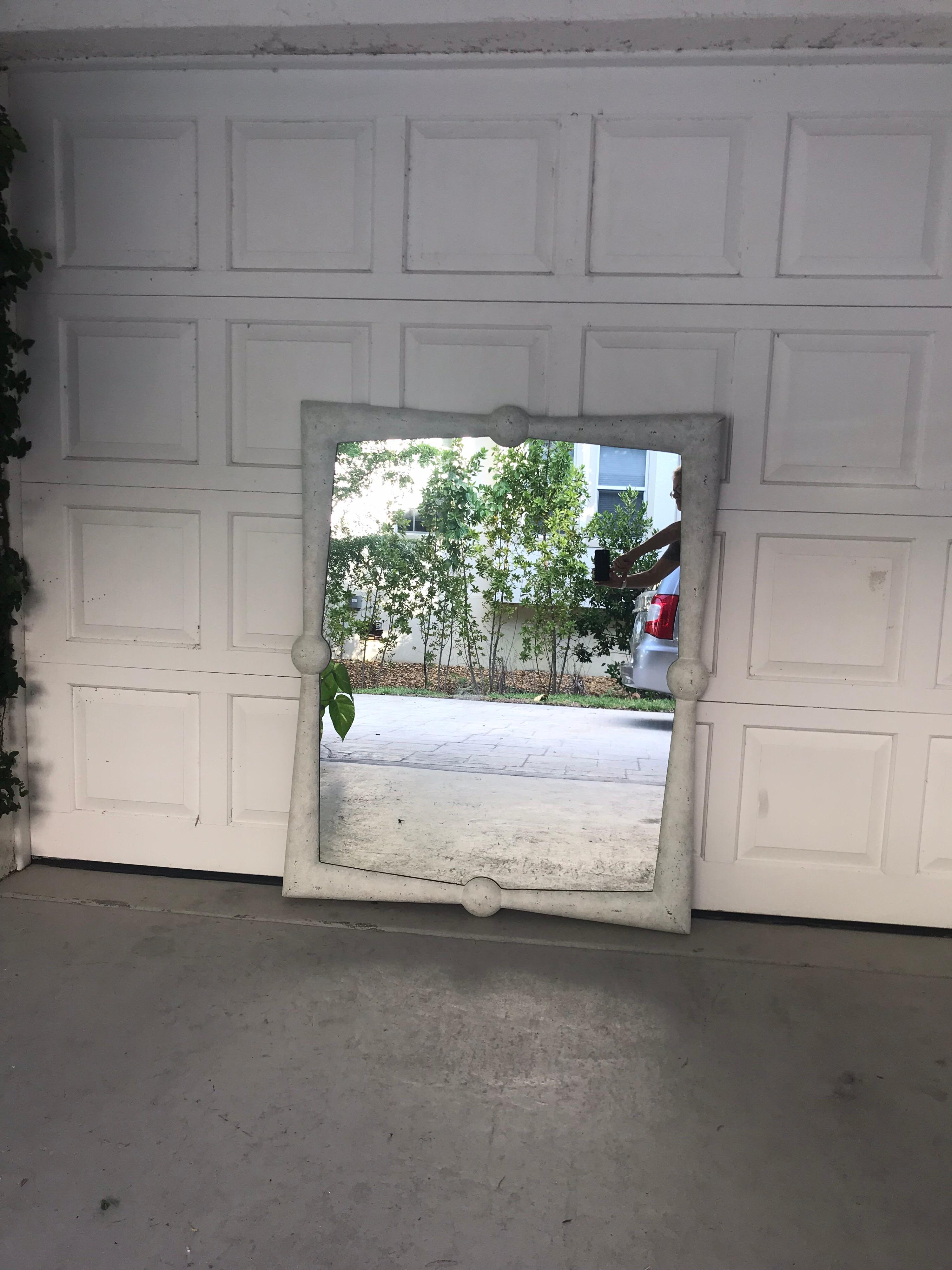 This is a large white washed resin mirror made by Gabby co.