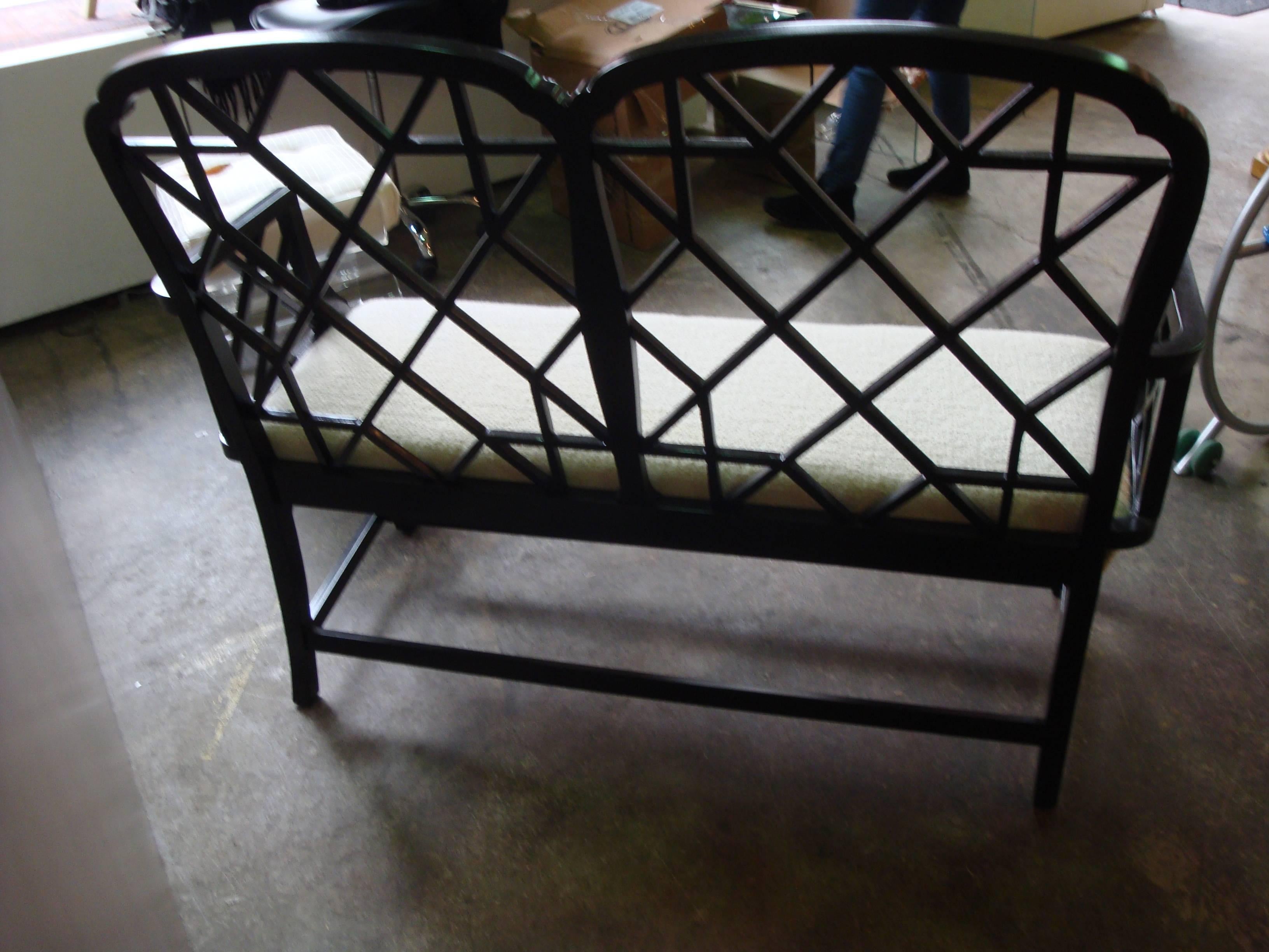 this is a chippendale wood black laquered bench , newlly upholstered in a nubby wool fabric 