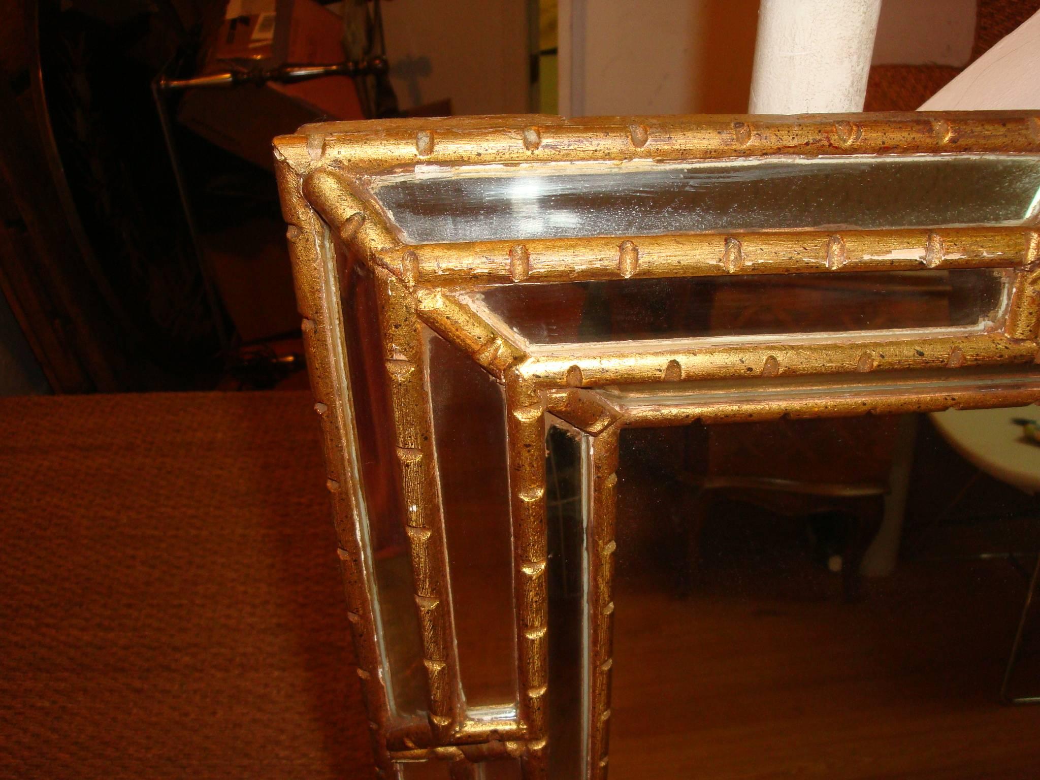 This is a 1970s Labarge gilt mirror.