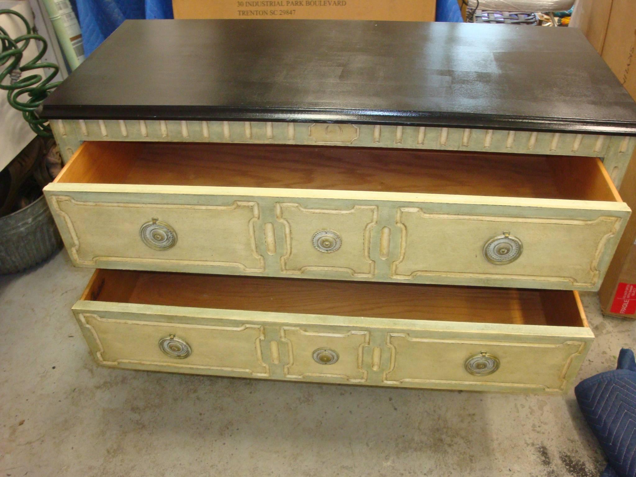 This is a Mid-Century two-drawer chest signed Bodart. The top is painted black and chest itself is a rubbed turquoise color.