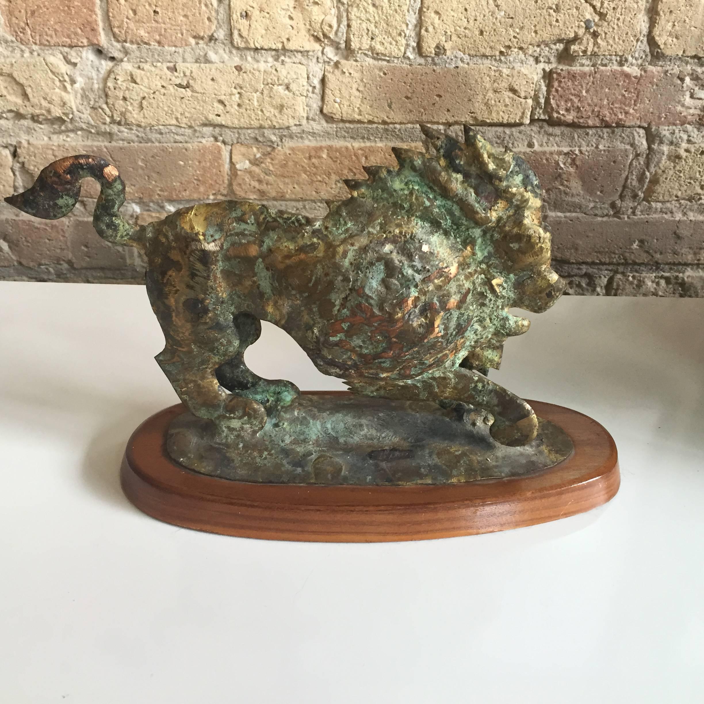 A Brutalist bronze sculpture of a lion by Bill Lett retaining its original base and label on the underside 