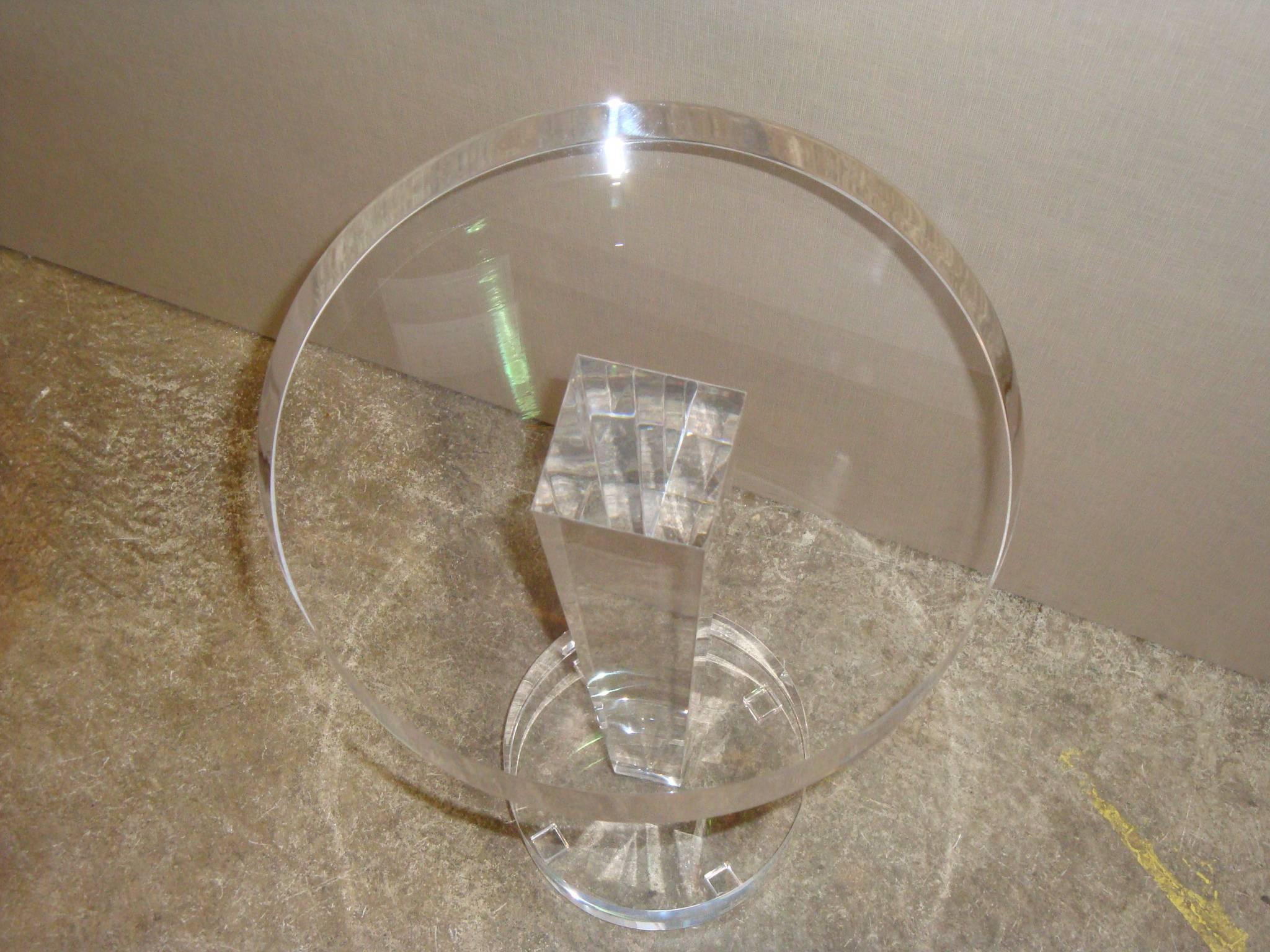 This is a newly made Lucite heavy pedestal side table.