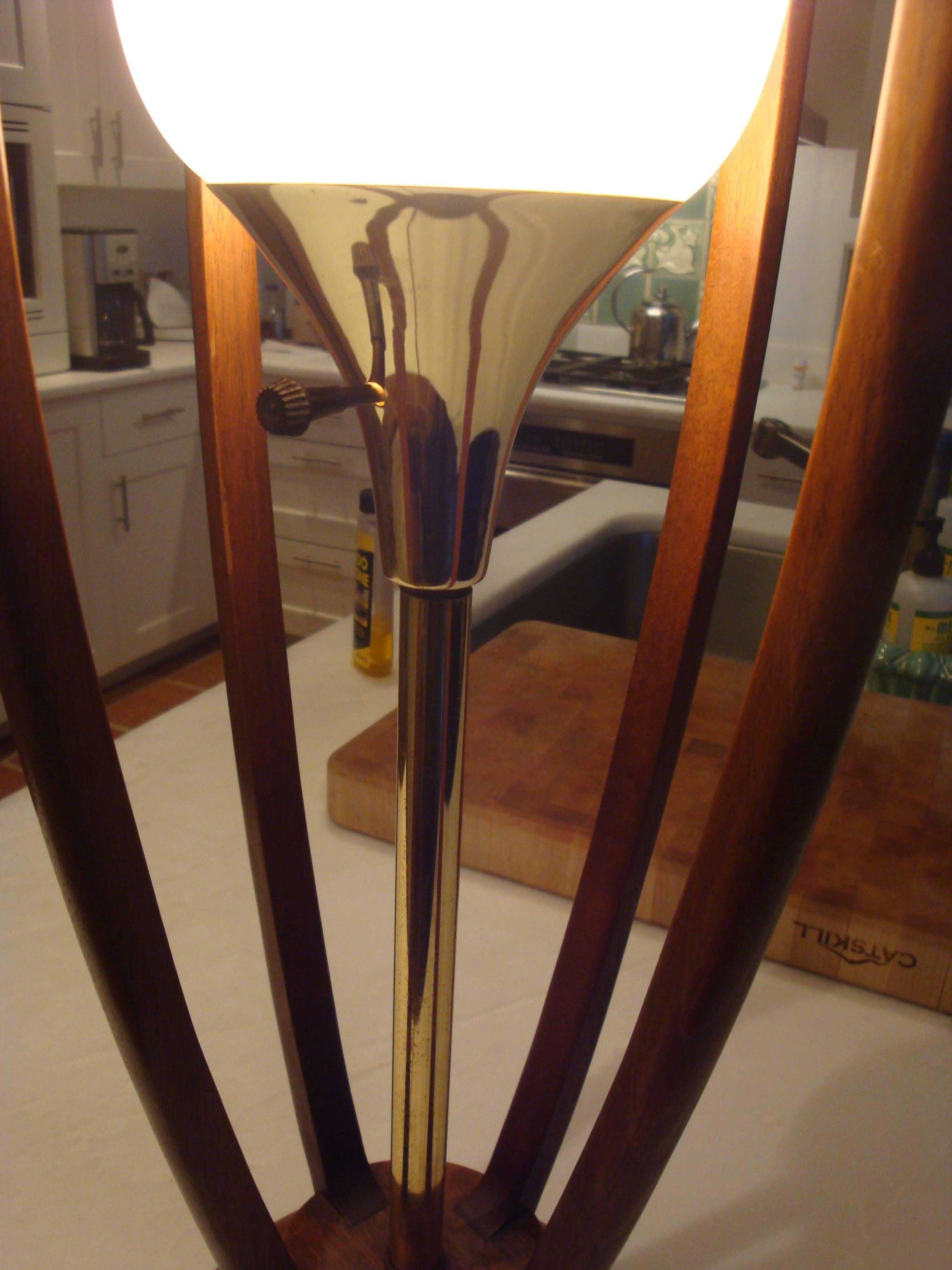 This is a large teak and glass lamp made by Modeline Co. in 1970s.