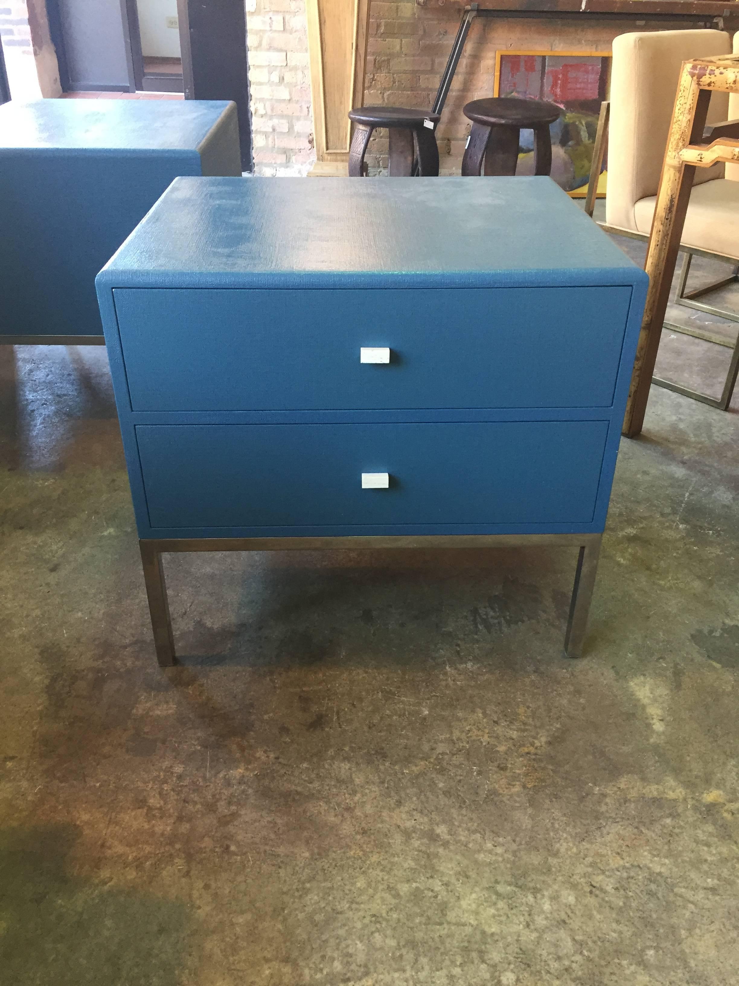 Dramatic pair of Ron Seff azure blue grasscloth nightstands having two drawers upon stainless steel square legs.