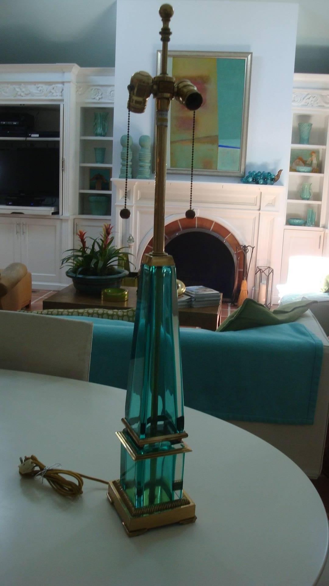 This is a vintage turquoise Murano glass and brass lamp made by the Marbro lamp Co. years ago.