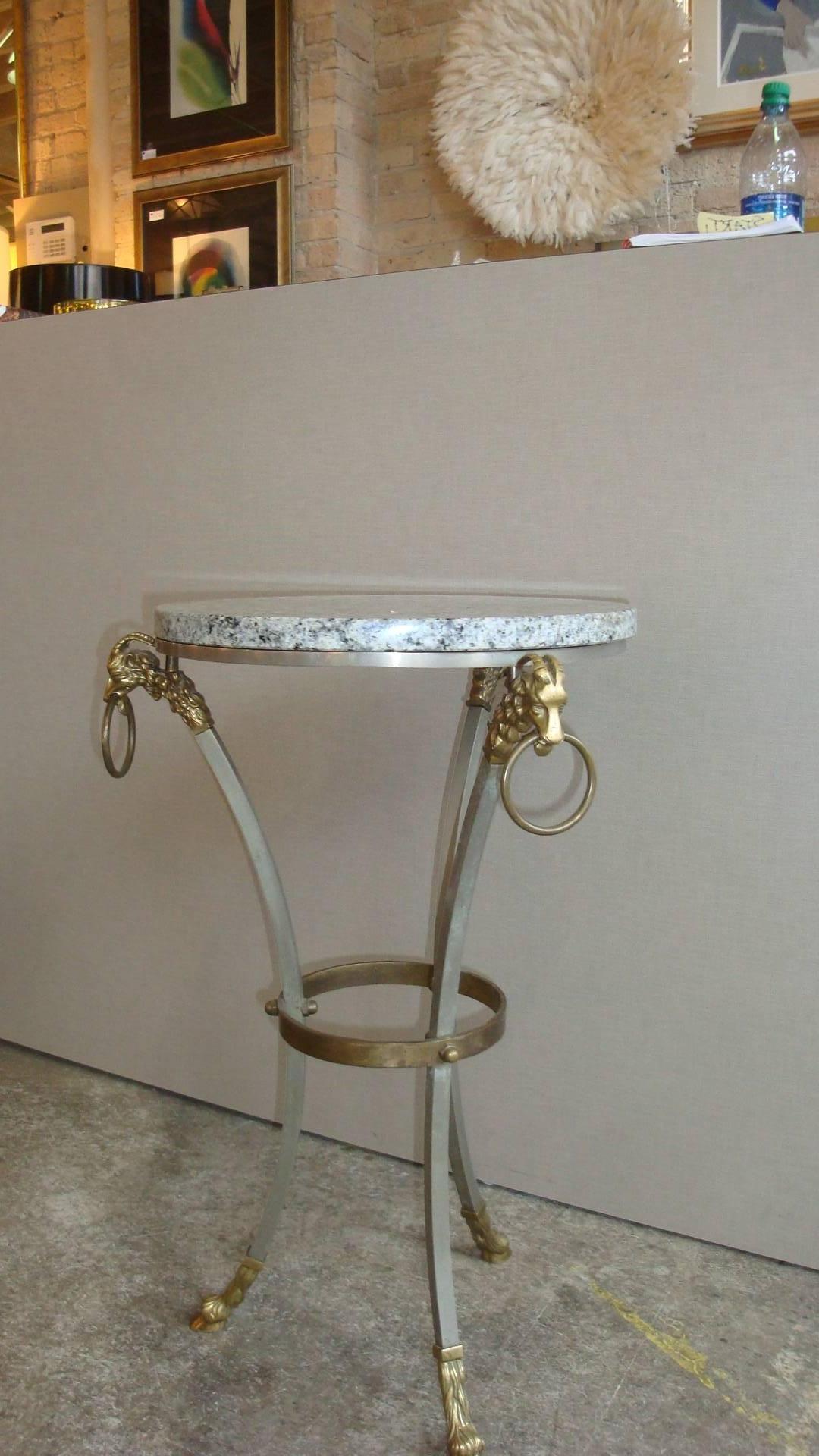 This is a Maison Jansen style metal and brass ram and hoof side table with a marble top.