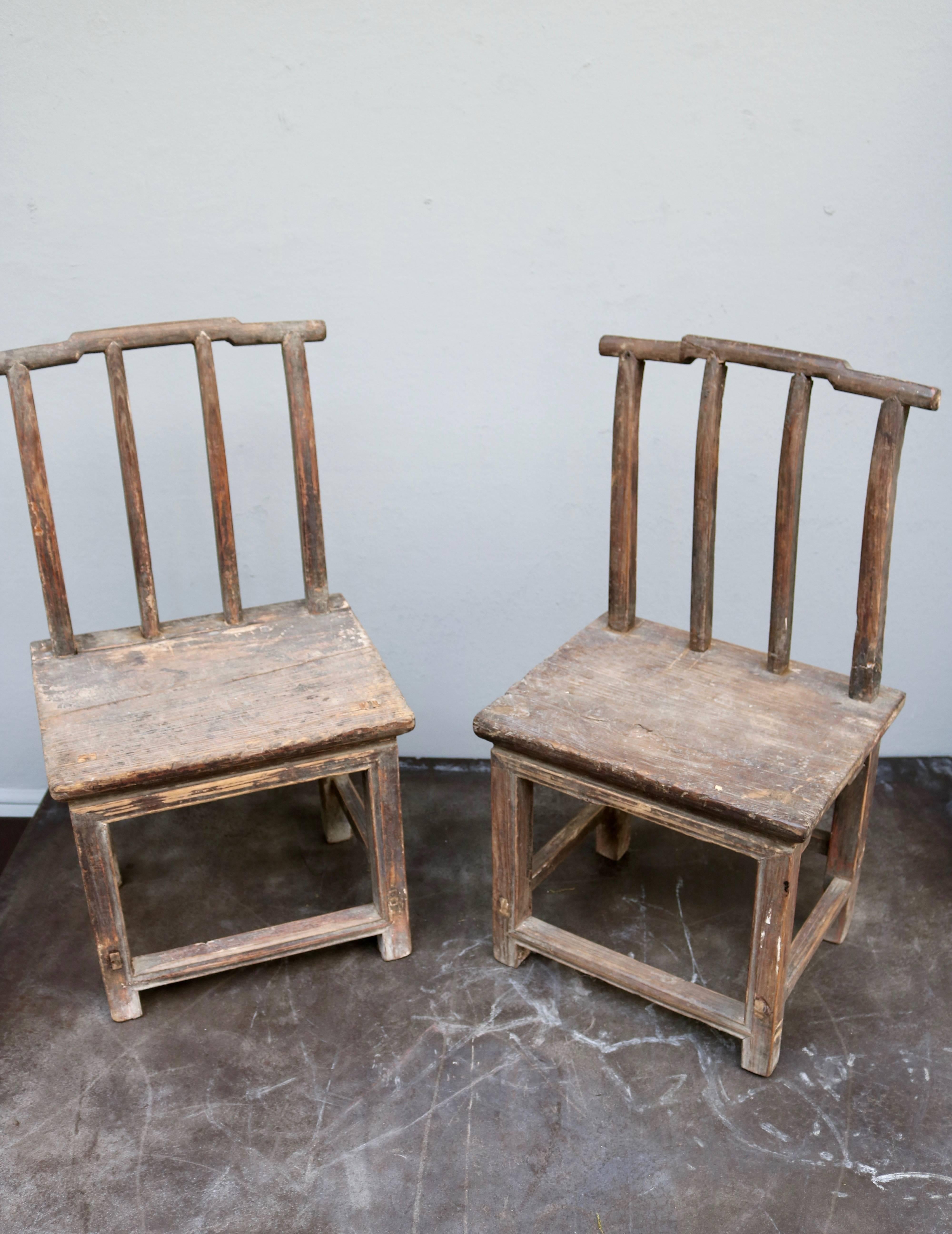 These chairs are sold in a pair of two. The chairs are made in Chinese elmwood from the 19th century.