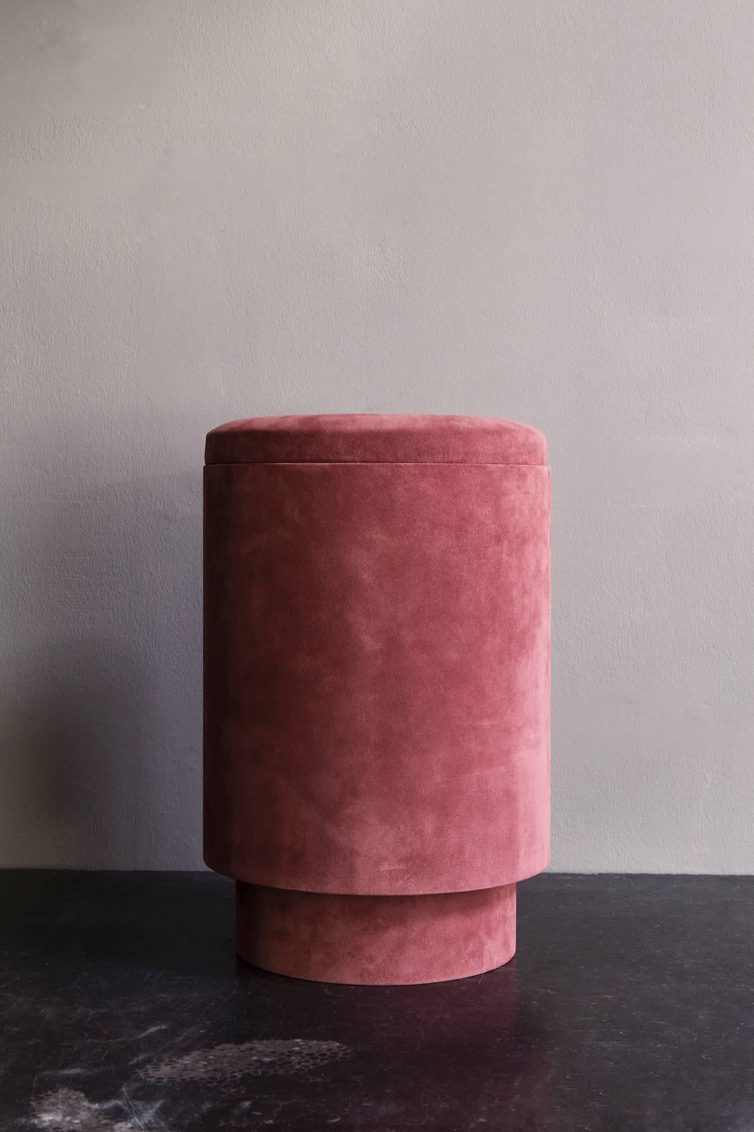 Pouf with storage space covered in the most beautiful suede in the color rose. Covered in black suede inside.