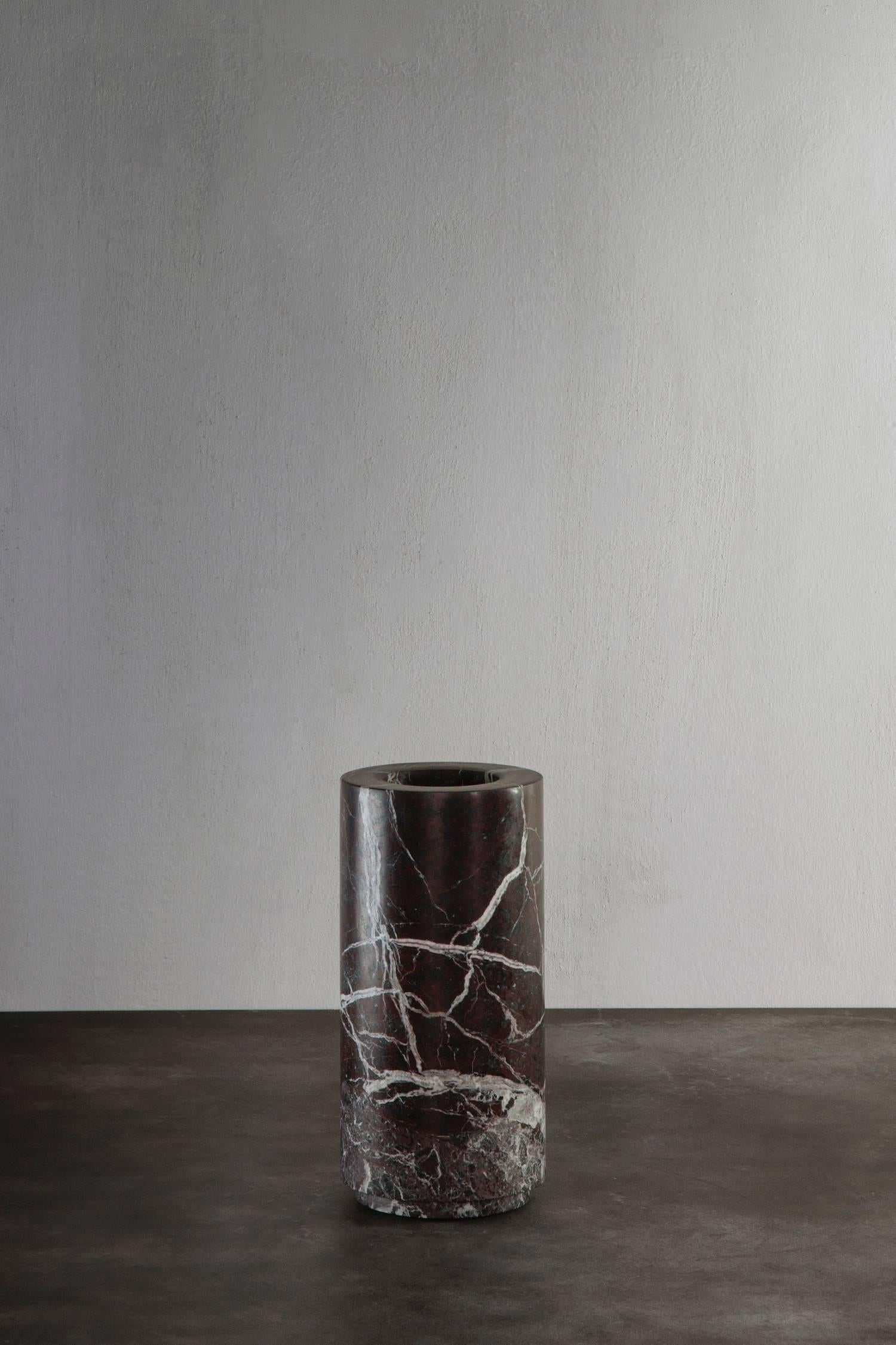 Cylindrical shaped vase in dark bordeaux marble - 'rosso levanto marble' from Michaël Verheyden. 
Please note: This item is located in our New York City Studio and will be shipped from there.