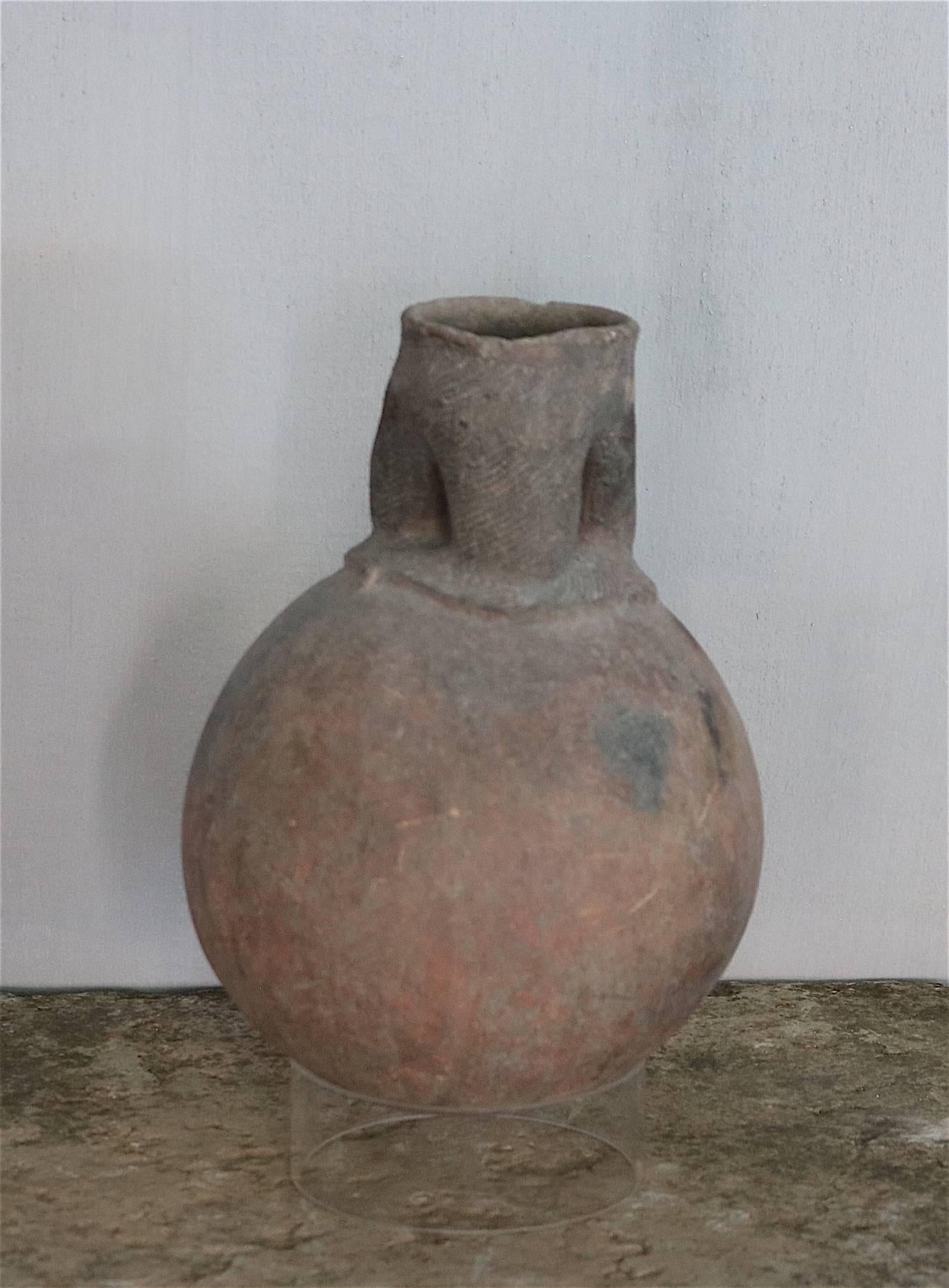 Lovely old clay pot from Nigeria originally used for sacrifices. The pot originates from a private French collection.