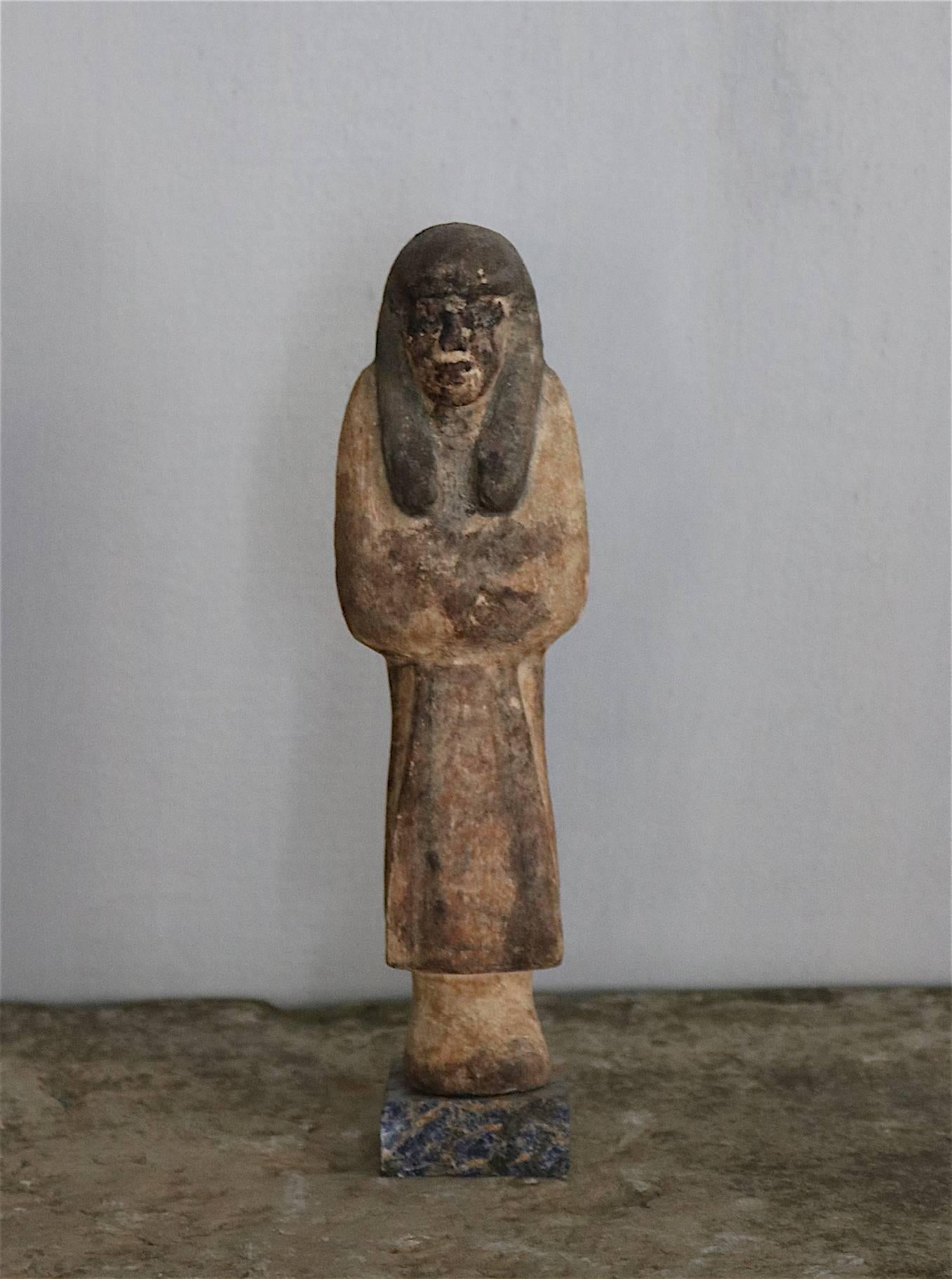 'Reis Ushabti' wooden figure from the ancient Egypt from the 20th-21st dynasty. Remians of paint.
Please note: This item is located in our New York City Studio and will be shipped from there.ase note, this item will be shipped from our New York City