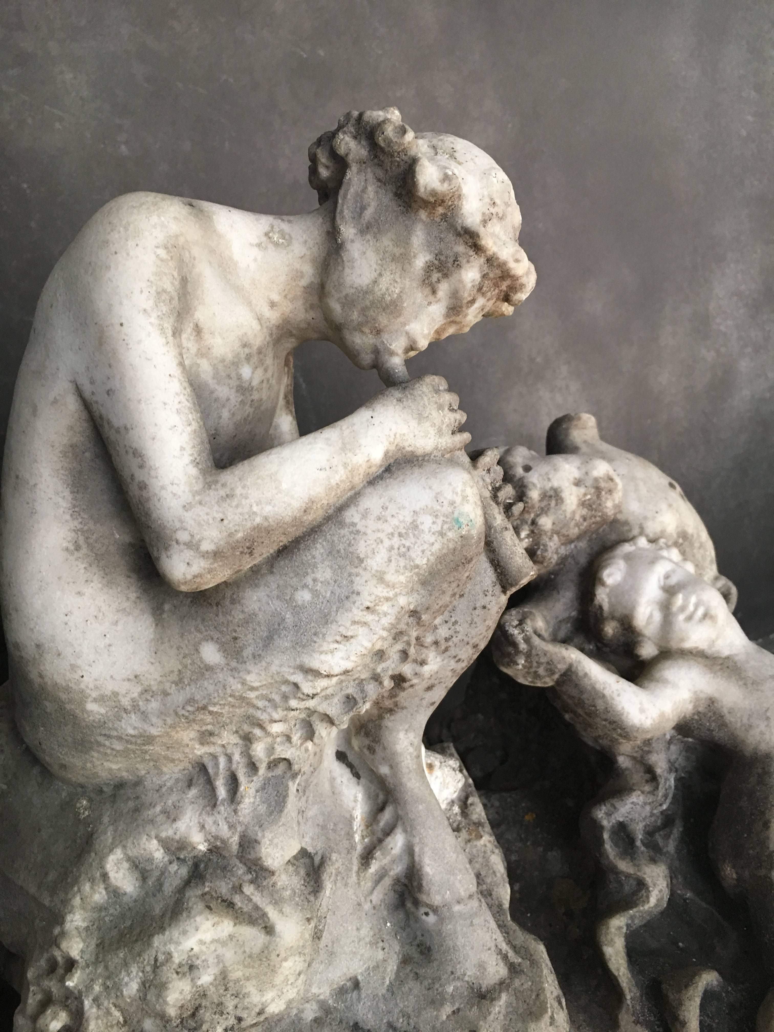 Italian marble sculpture from the late 18th century. A faun is showing in the middle. The sculpture has a beautiful patina with old broken-off pieces.
Please note: This item is located in our New York City Studio and will be shipped from there.