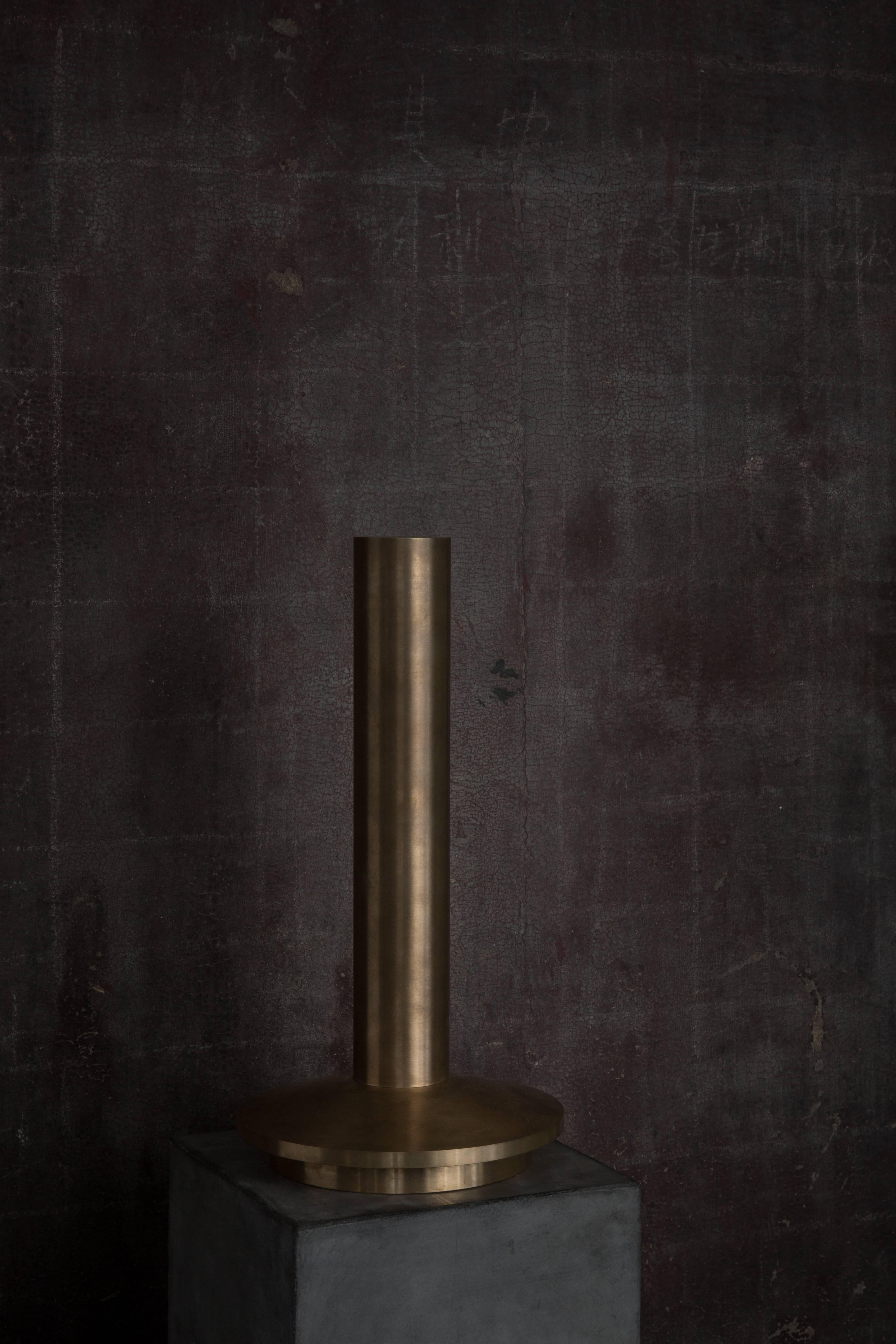 Large candlestick from Michaël Verheyden in solid brushed bronze.