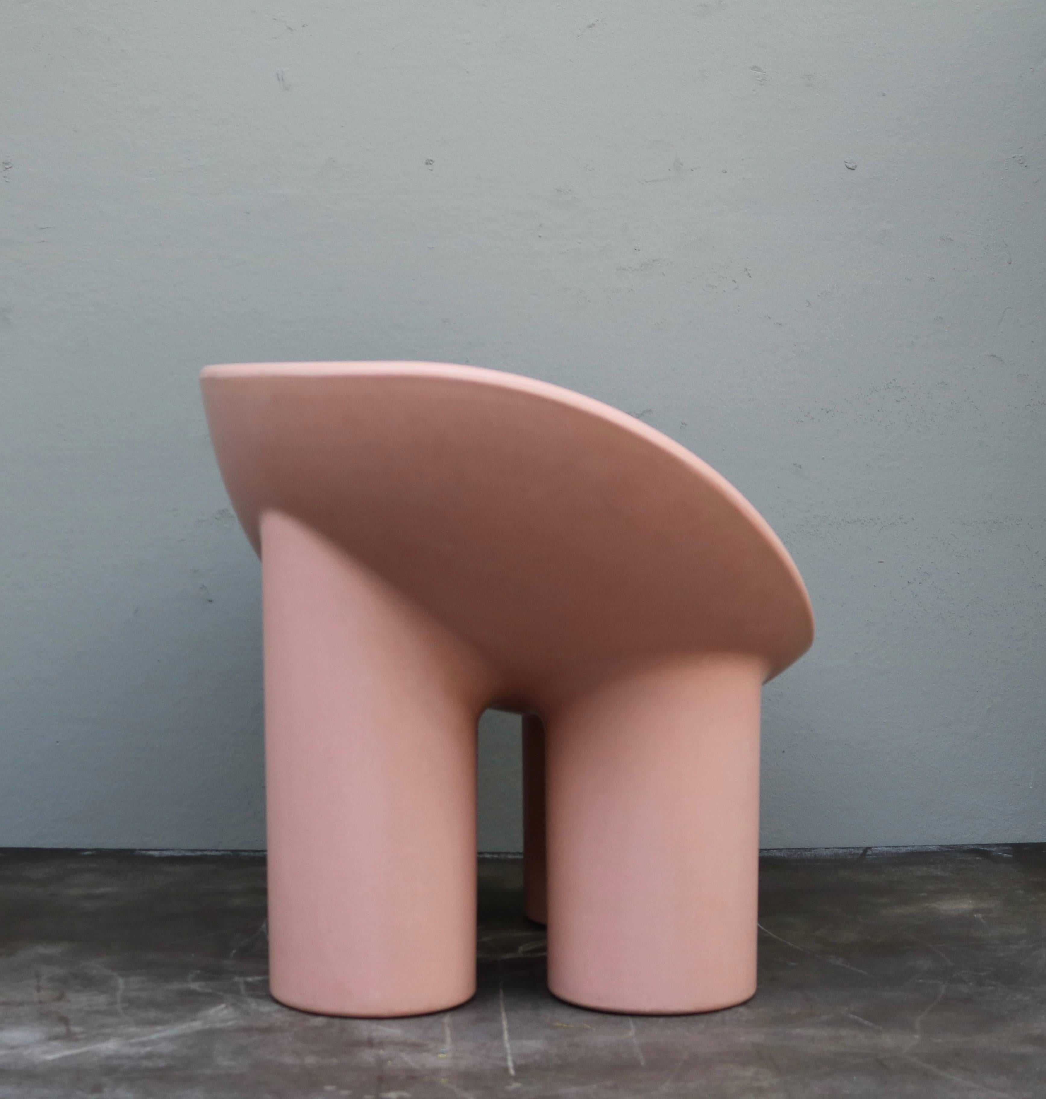 The Roly Roly chair by Faye Toogood has a dish-shaped seat crafted in raw fiberglass for strength and durability.