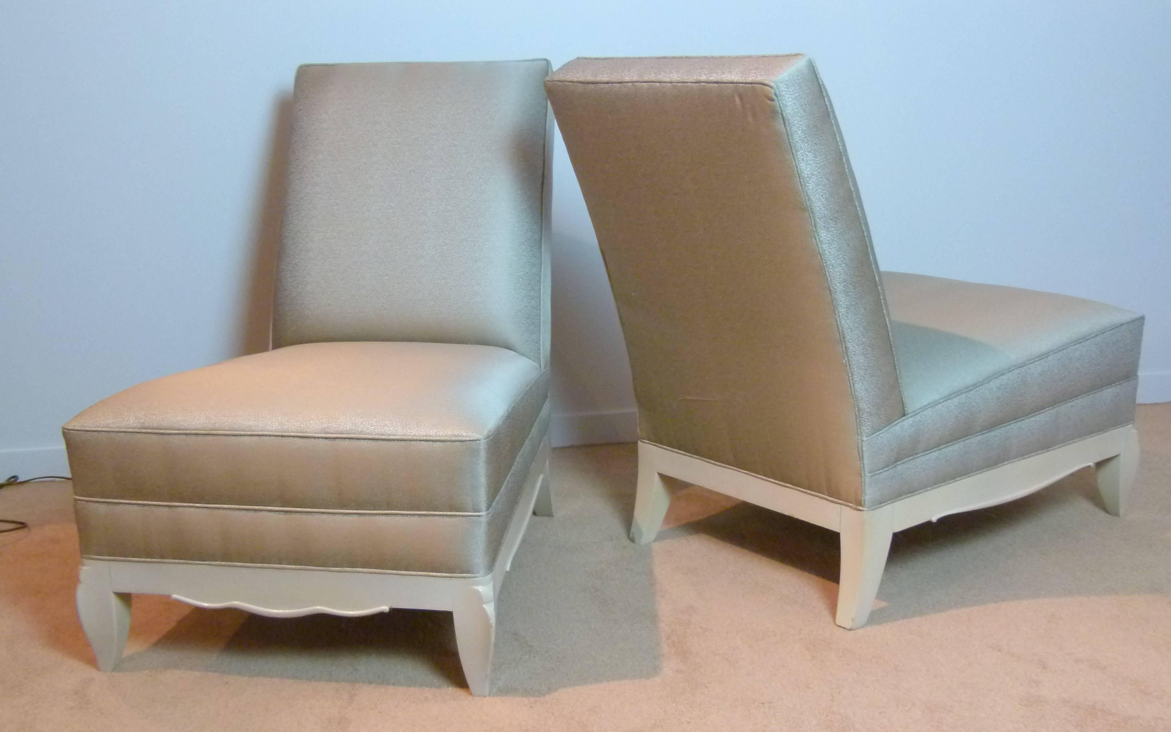 Pair of large and elegant low armless armchairs with an ivory lacquered wooden structure (original lacquer with a small chip on one front foot.)
Rear saber base front feet decorated with a fluid carved movement and the front and side belt decorated