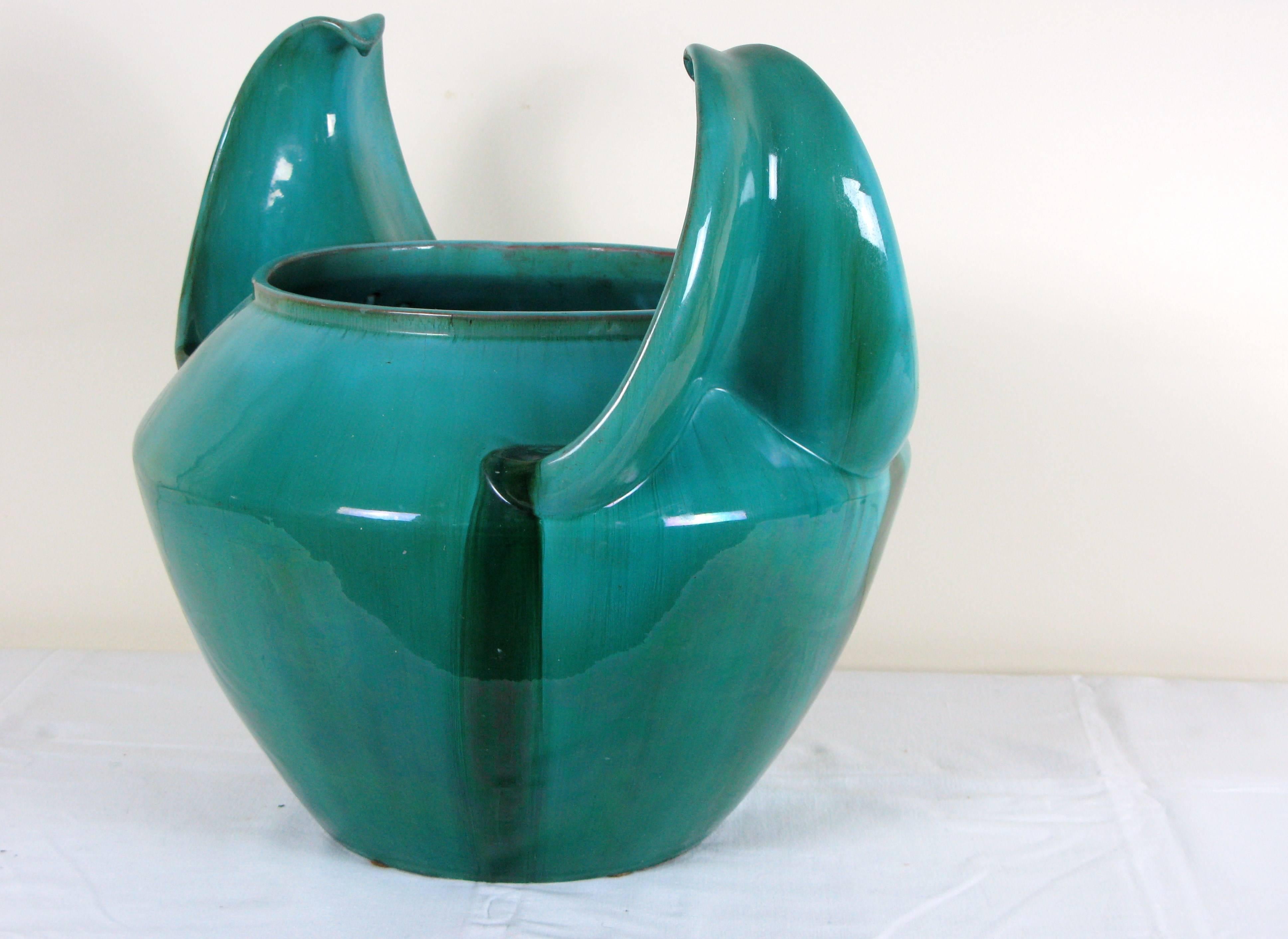 Circular mottled green ceramic vase with two large handles on the sides.
French Art Deco work of Clement Massier signed under the base.
Perfect condition.