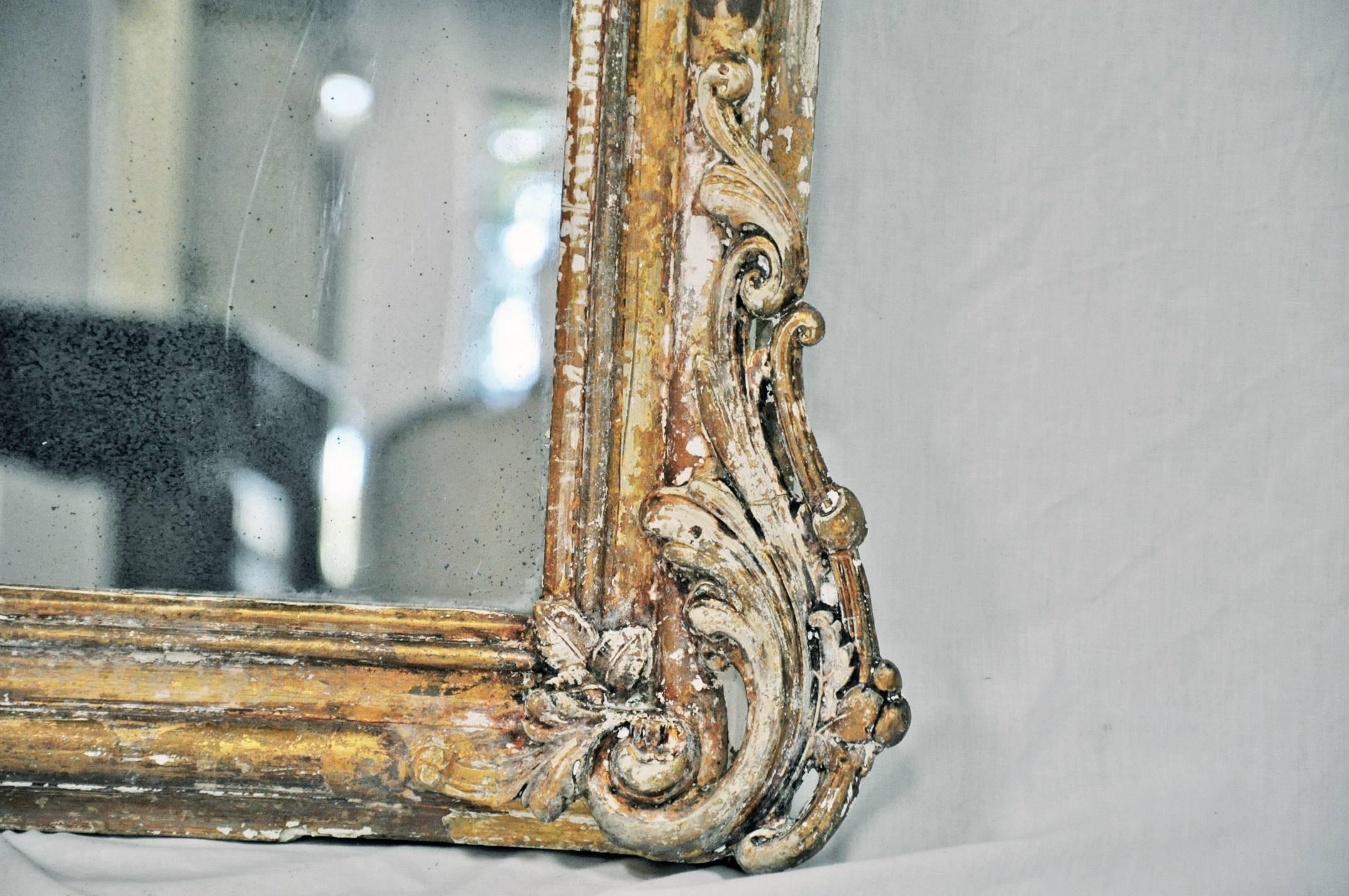 19th C. Arched Top 'Shabby Chic' Mirror w/ Partially Stripped Gold Gilt Finish In Distressed Condition In Houston, TX