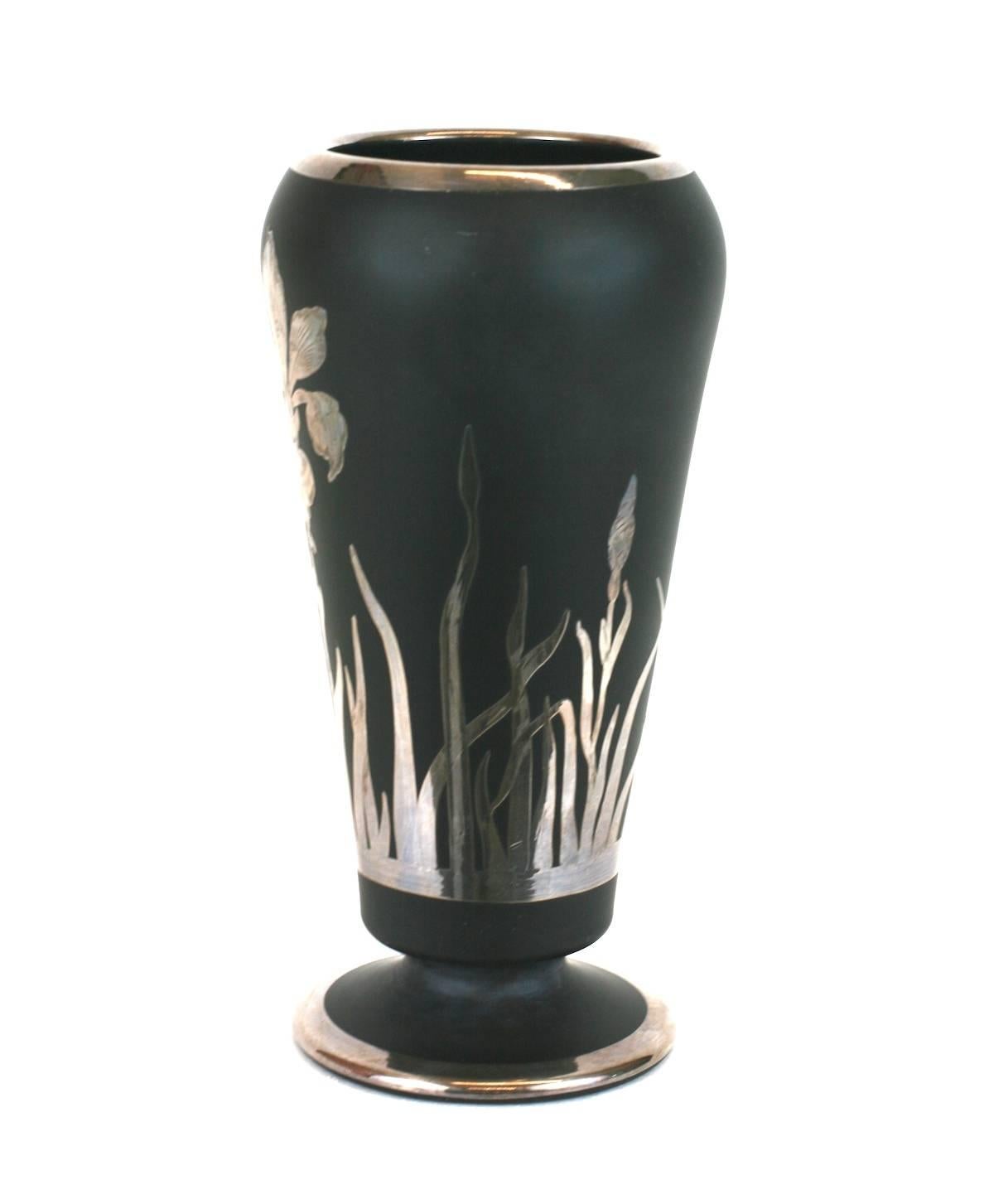 Lovely Art Deco silver overlay iris vase on matte black glass base circa 1930 by the Rockwell Silver Company of Meriden Ct. Elaborate etch work in sterling silver overlay of a central iris motif with leaves emanating from base.
Signed 