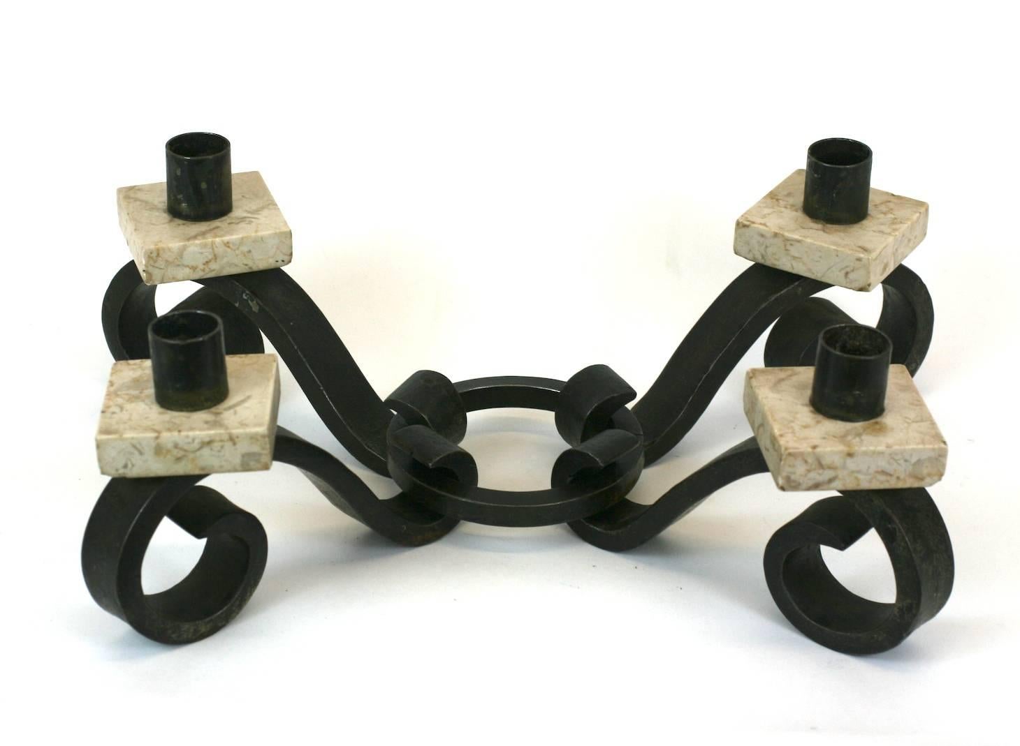 Interesting and unusual set of 4 Art Deco wrought iron and marble candleholders with a pair of decorative iron rings to reconfigure as desired. May be transformed and made into one larger centerpiece, a pair or used individually.
American,
