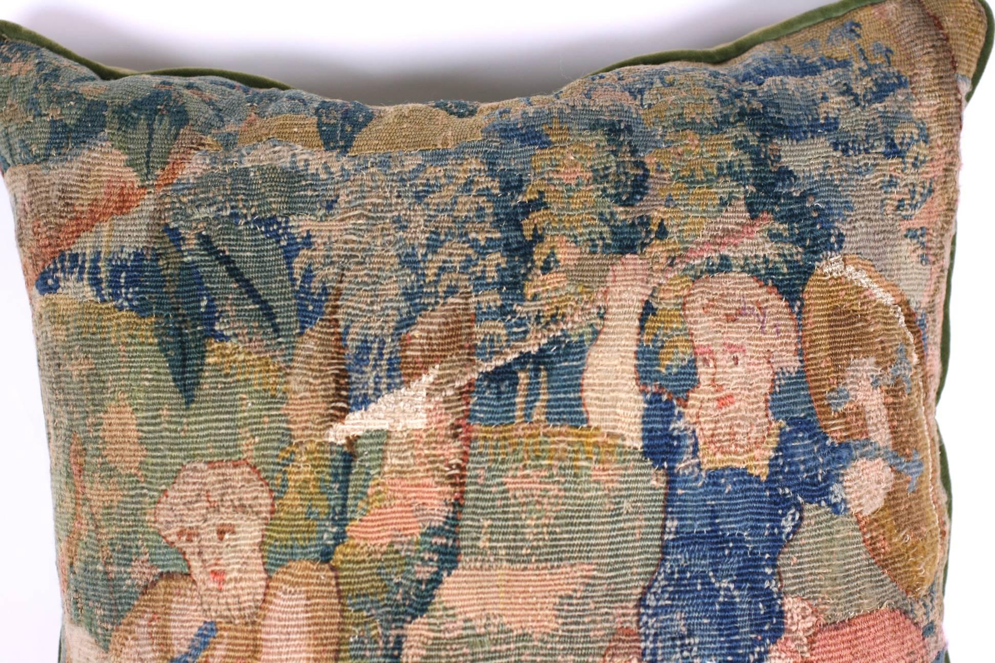 Aubusson tapestry cushion of battling Satyrs, likely created from a textile from the late 18th century. Cotton velvet backing with piping. Excellent condition.
Measures: 20