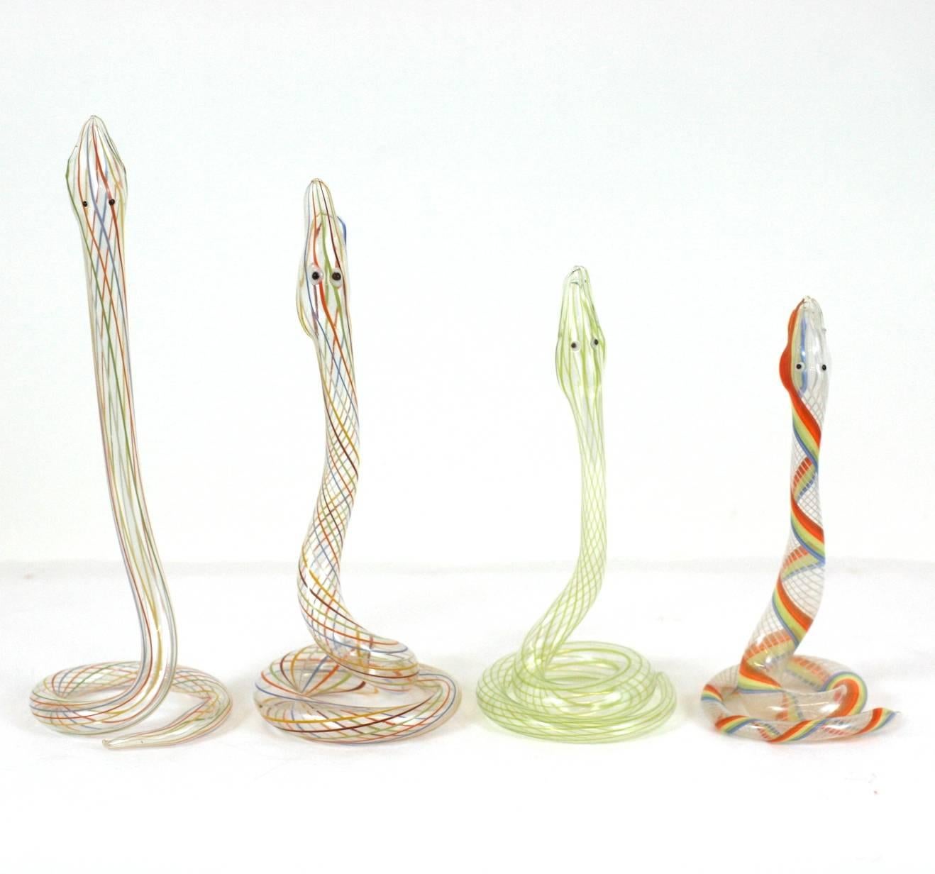 Charming multicolored snake bud vases by Bimini. Various sizes and colorings with very cartoon faces. Incredibly delicate, paper thin glass from the deco period, Germany, 1930s.
Range in sizes: 9