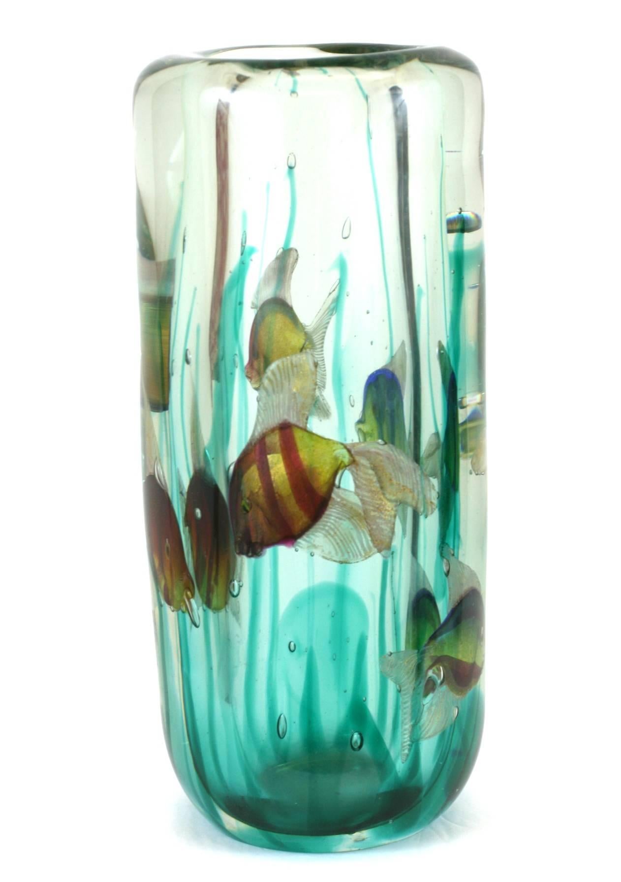 Lovely Barbini aquarium vase with original light base. Seaweed tendrils rise toward the top with beautifully detailed fish throughout. When lit from below, the piece comes to life.
Glass walls measures 1.5