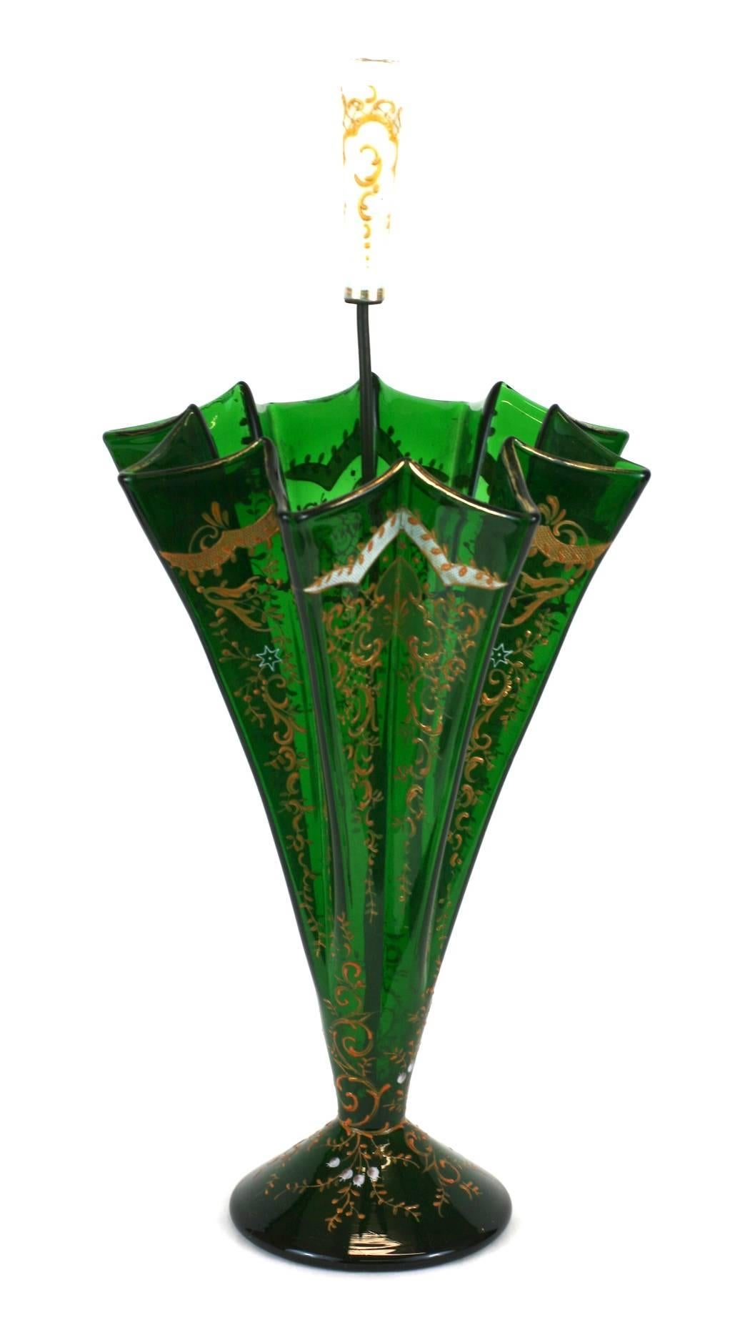 Charming and unusual Victorian glass umbrella vase with hand enameled raised gold and white decoration. Deep green glass with enamel decoration, repeated on the milk glass handle. Interior wire work system hold flowers in place while supporting