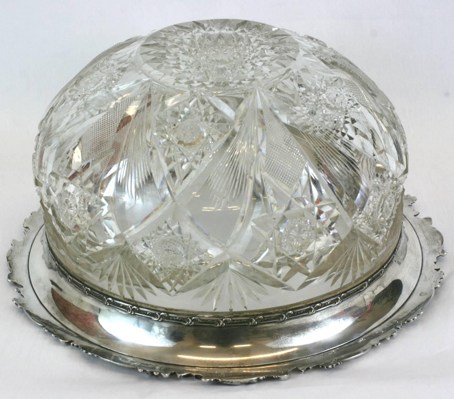 Large crystal punch bowl with large repousse sterling lip. Brilliant cut crystal by Hawkes in star motifs (Holland pattern) encircle the bowl. Floral trimmed sterling lip along edge. Extremely, extremely heavy quality piece (approximate 20 lbs). Has