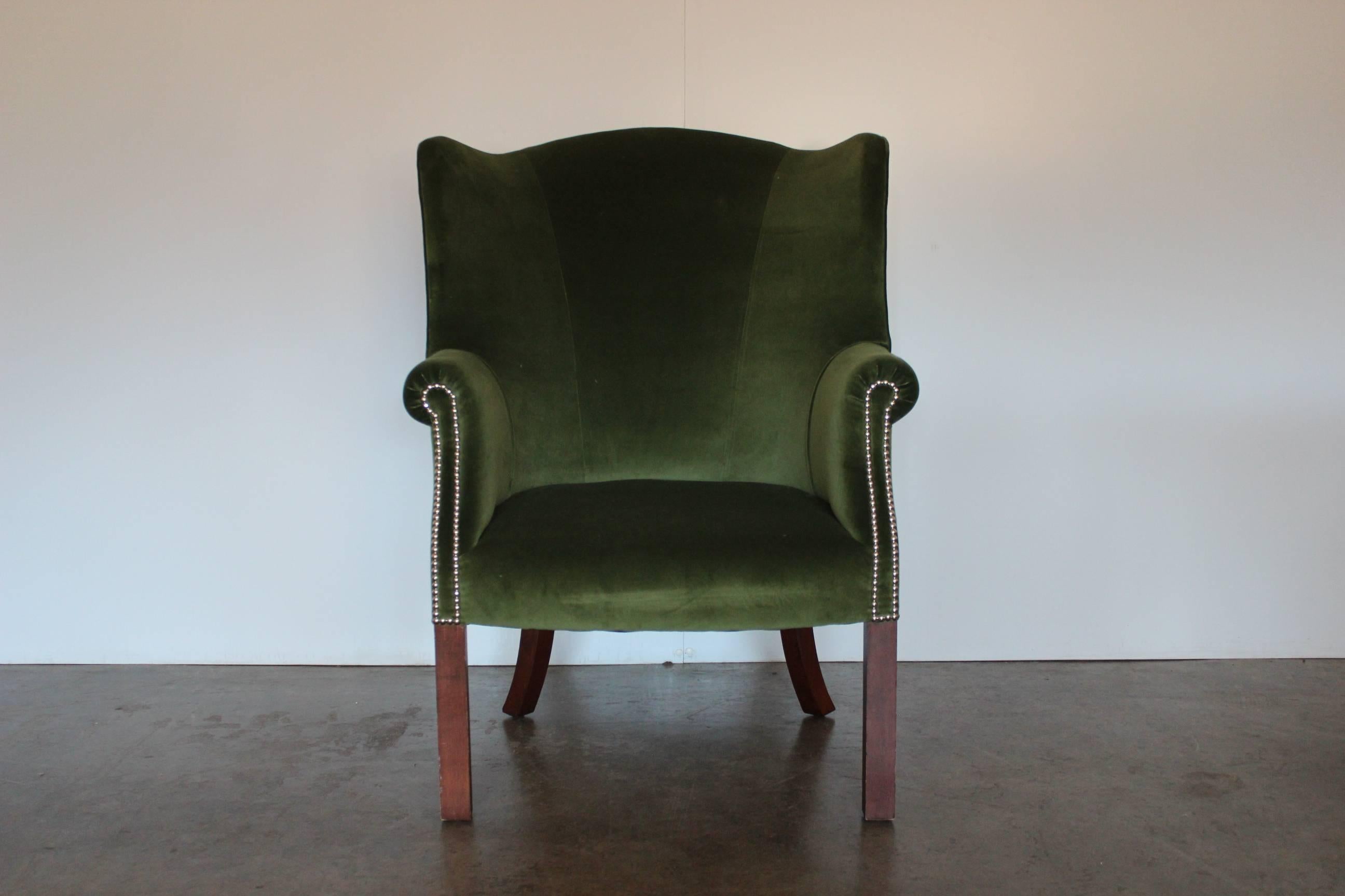 On offer on this occasion is an incredibly rare Ralph Lauren compact “wingback” armchair, dressed in a peerless, top-grade, Ralph Lauren “English Riding” cotton velvet fabric in a warm, welcoming royal green, and with polished-chrome stud-detailing