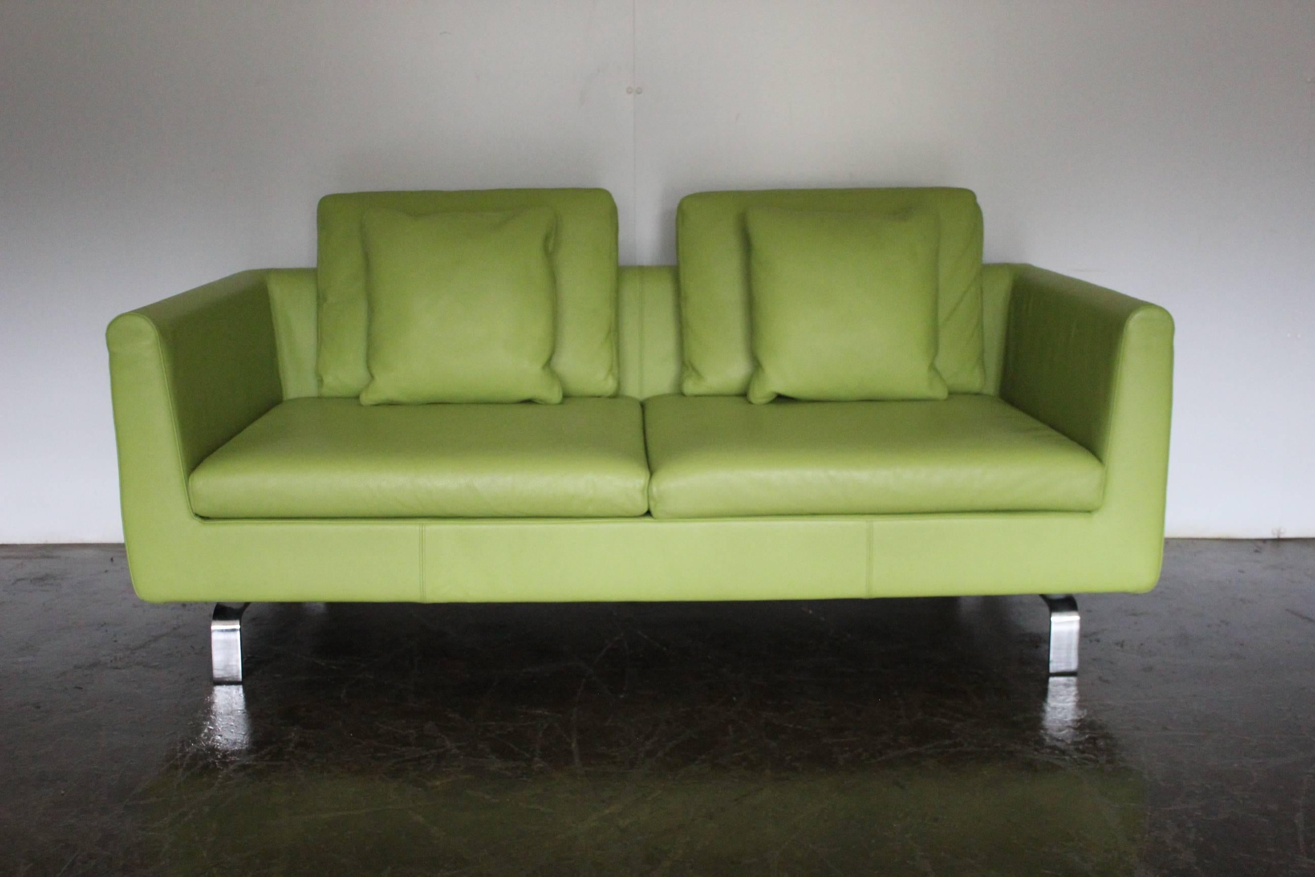 On offer on this occasion is a rare, pristine pair of 2.5-seat sofas, from the world renown German furniture house of Walter Knoll, dressed in a sublime matte Lime-Green leather, and with matte polished-steel framework.

As you will no doubt be