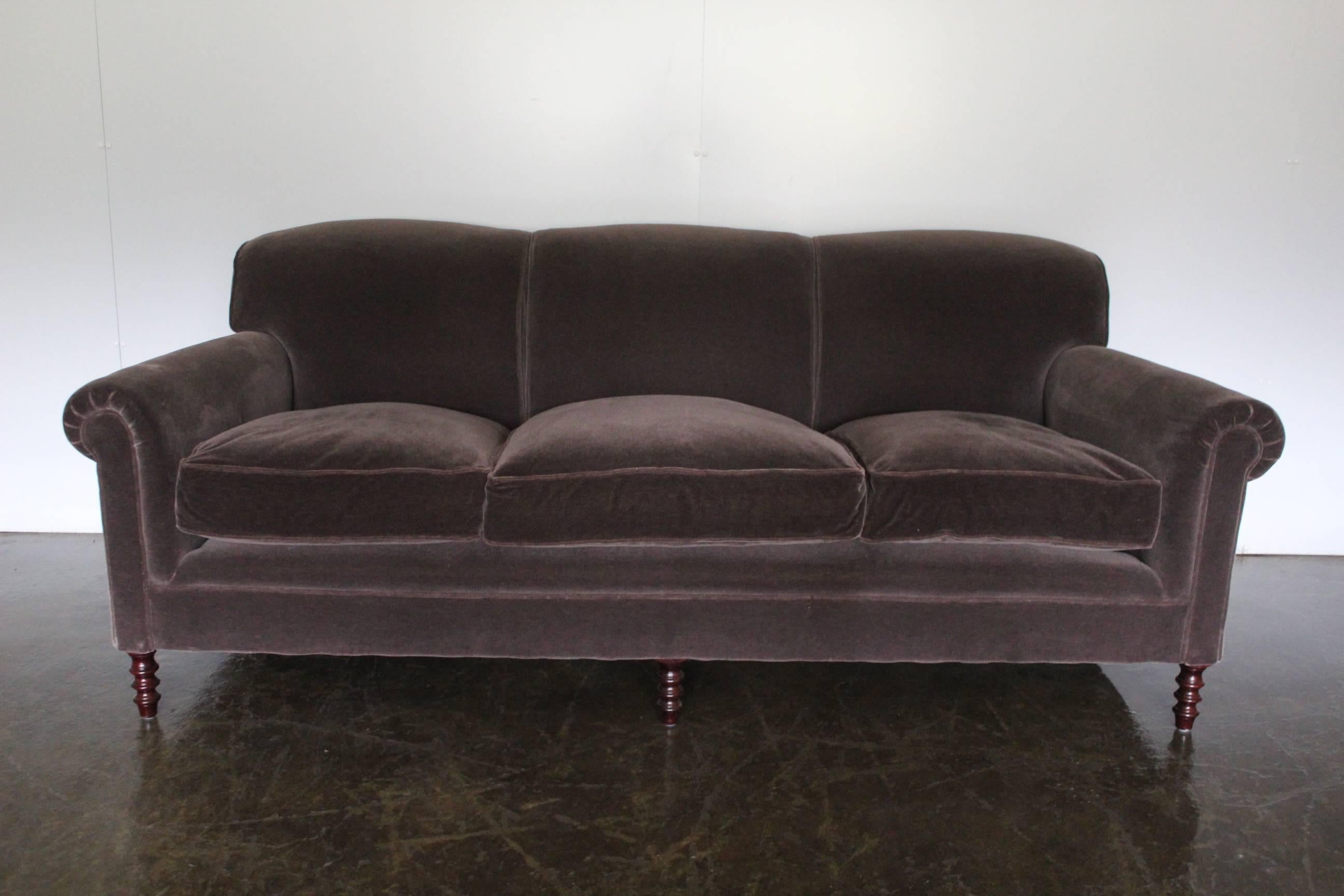 On offer on this occasion is a superb identical pair of George Smith signature ” Scroll-Arm” fixed-back large three-seat sofas in their most stunning mohair velvet fabric in “Mink” brown, and furnished with dark-oak hand-turned legs.
As you will no