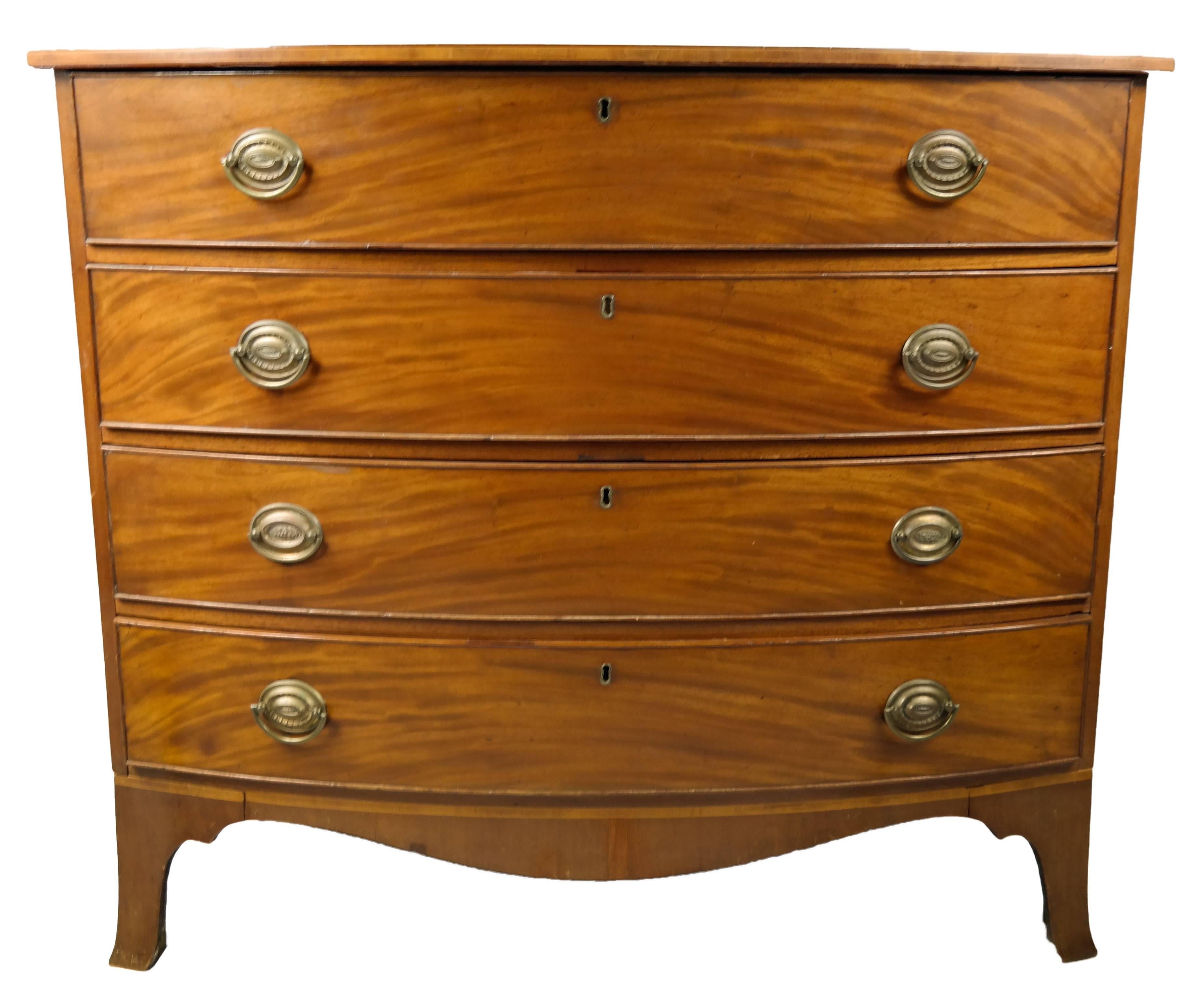 Mahogany bowfront chest of drawers, a single board top with banding and inlay, above four drawers with beading, a banded base on splayed feet, made in New England (Mass.), ca. 1790.