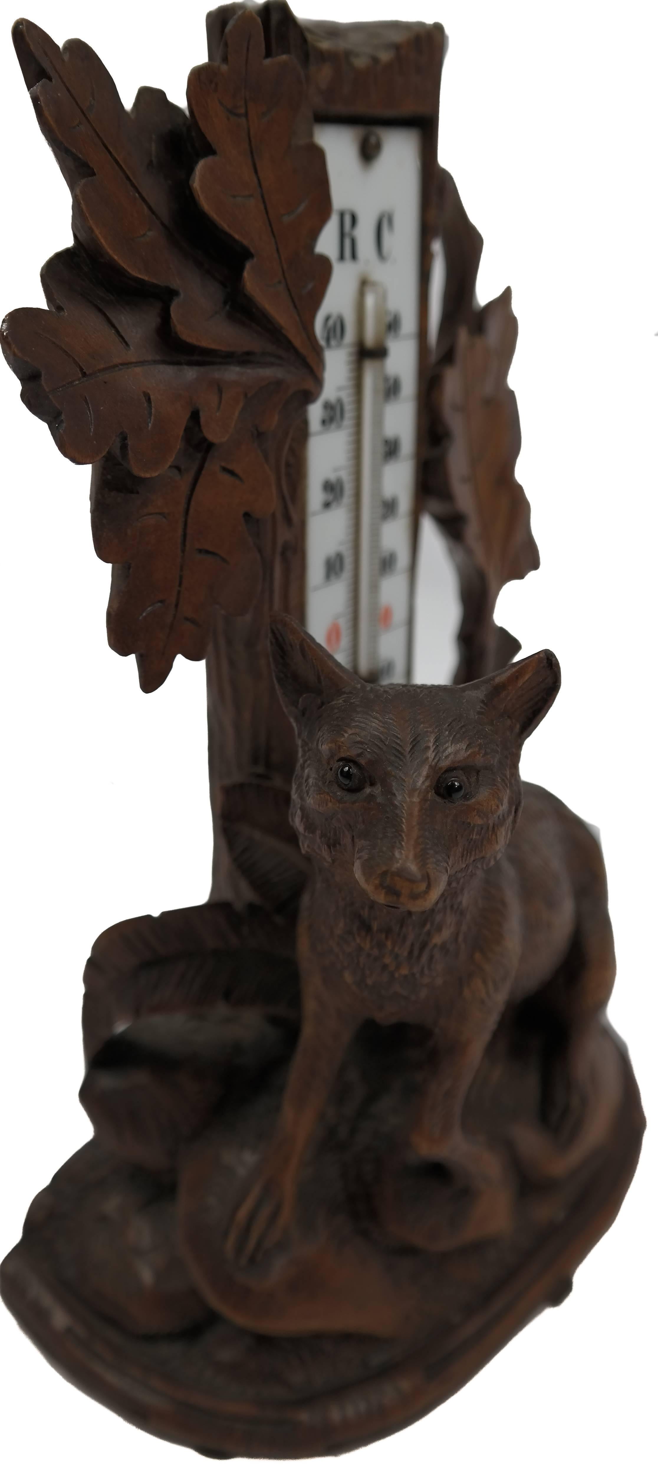 Carved black forest Swiss thermometer, with a magnificently detailed fox and forest scene. Ca. 1880. In phenomenal condition.