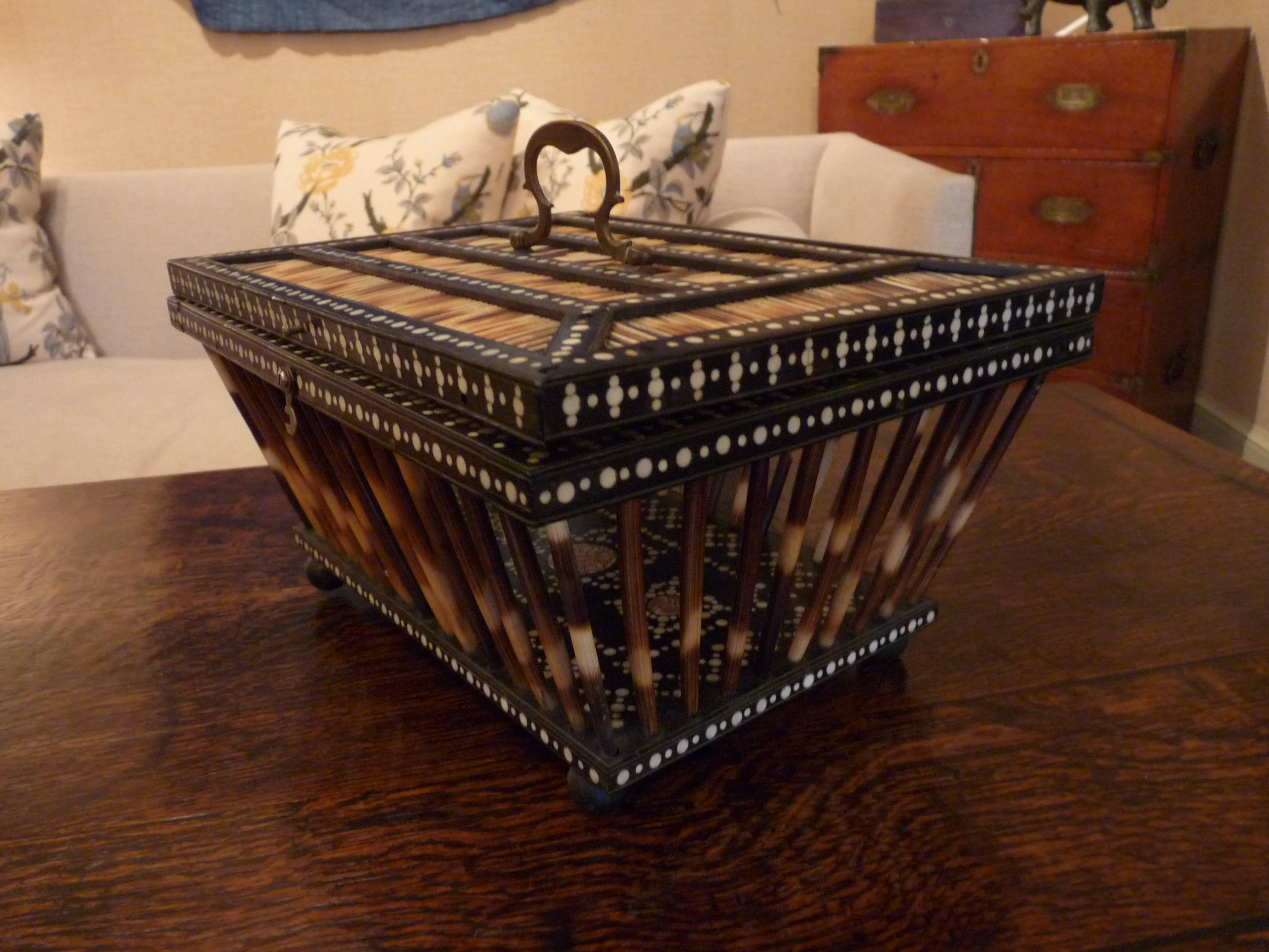 This basket box is an impeccable example of Indian porcupine quill basket and box craftsmanship and is one of the nicest we've had.  It is in fantastic condition and has brass hardware. 
