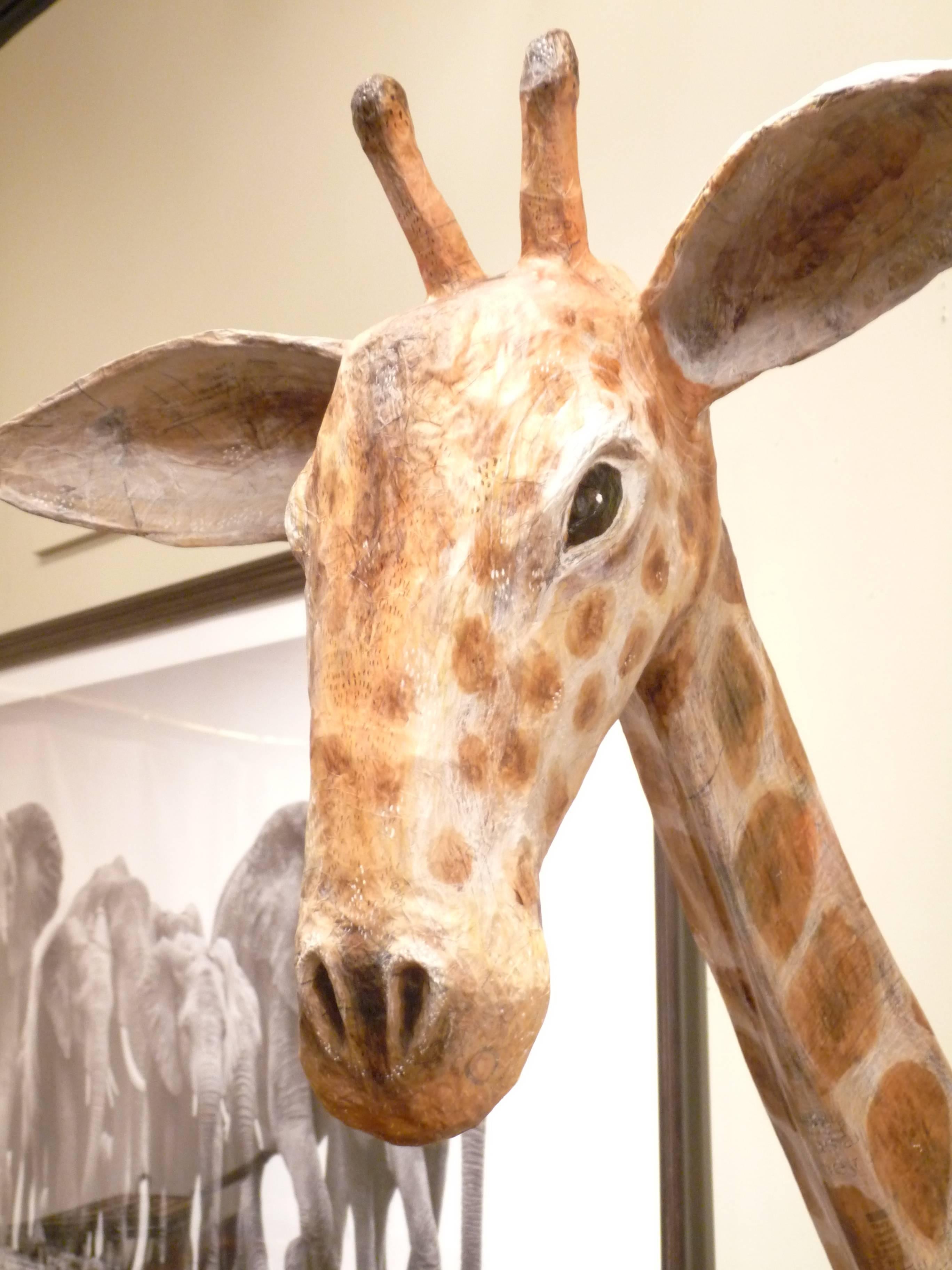 Let this lovely giraffe poke her head into your life.  Hand-crafted by British artist Emily Warren, she is sure to be a showstopper in any room.