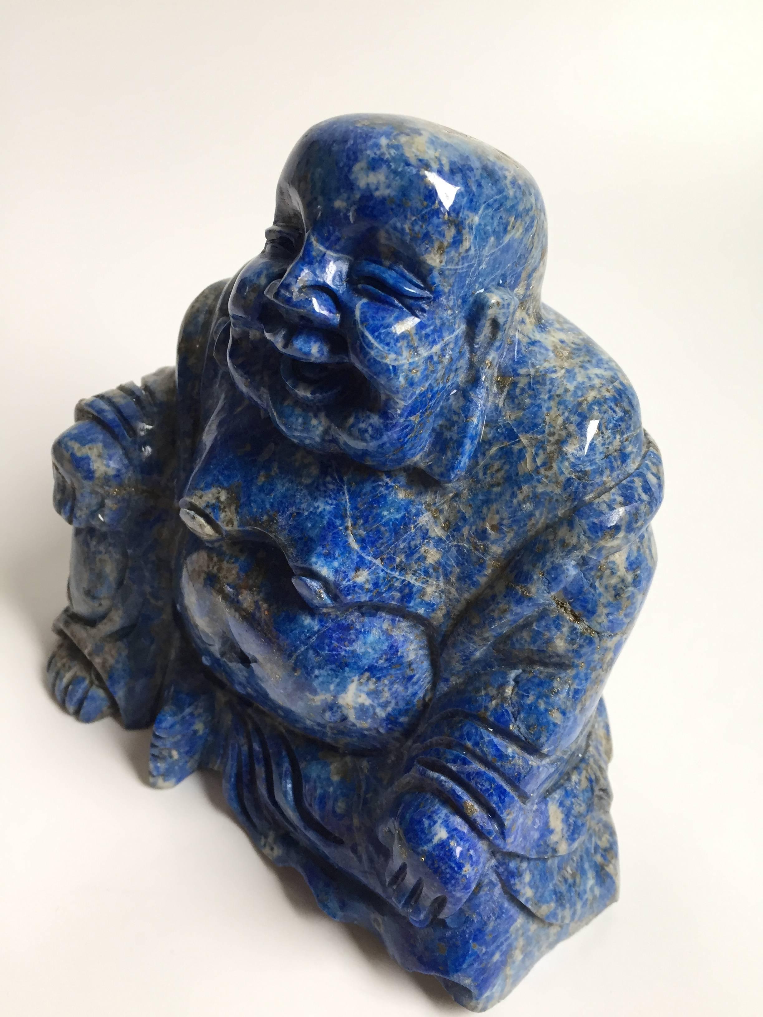 The gem stone that is used in this sculpture is a fine example of all natural Lapis Lazuli. Its vivid blue color laced with sparkling gold is a true beauty. 

Happy Buddha brings happiness and joy. 

All natural. Hand-carved. 

3.4 lb (1675
