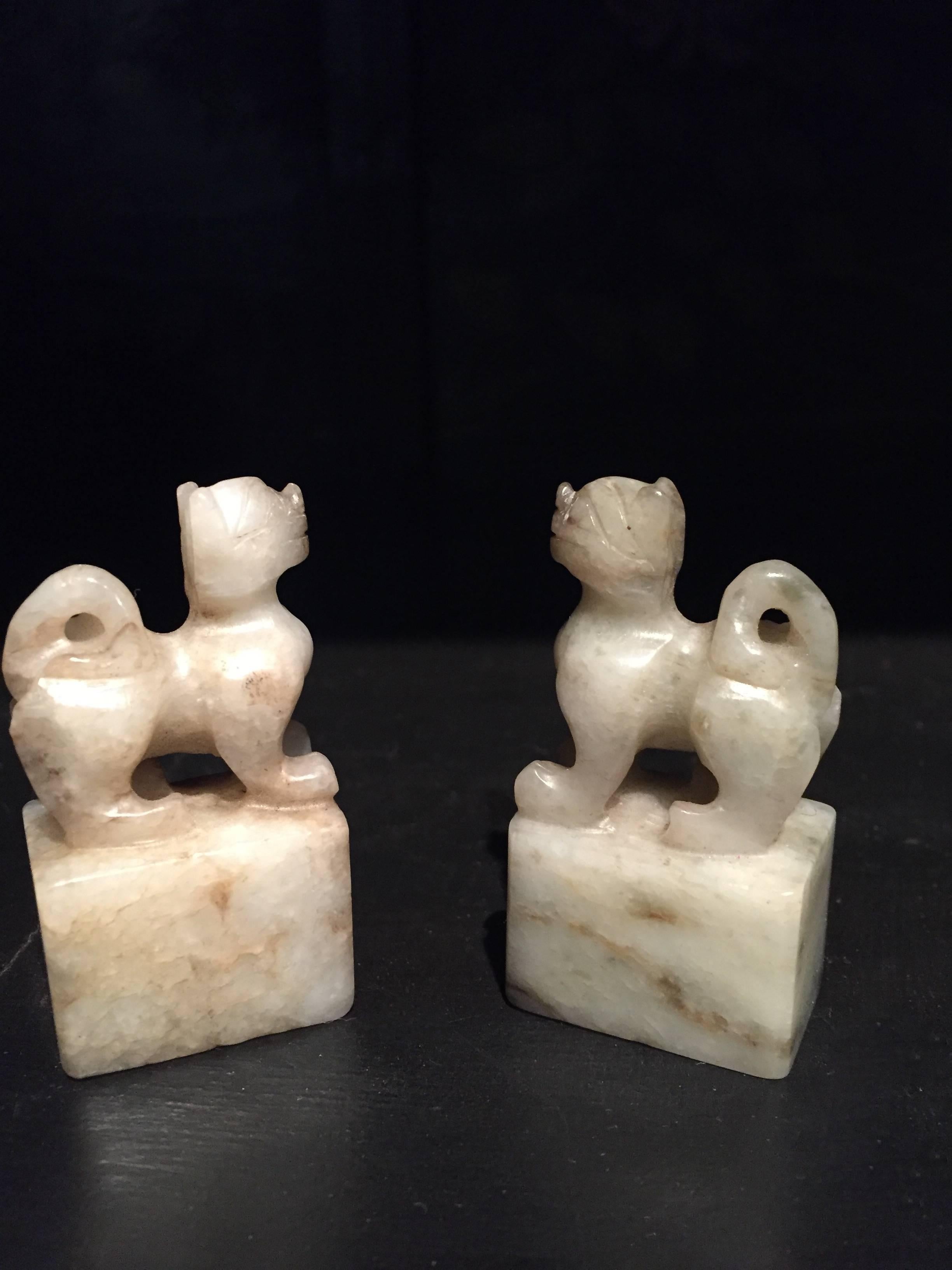 Carved 19th Century Pair of He Tian Rice Texture Jade Foo Dog Lion Chops For Sale