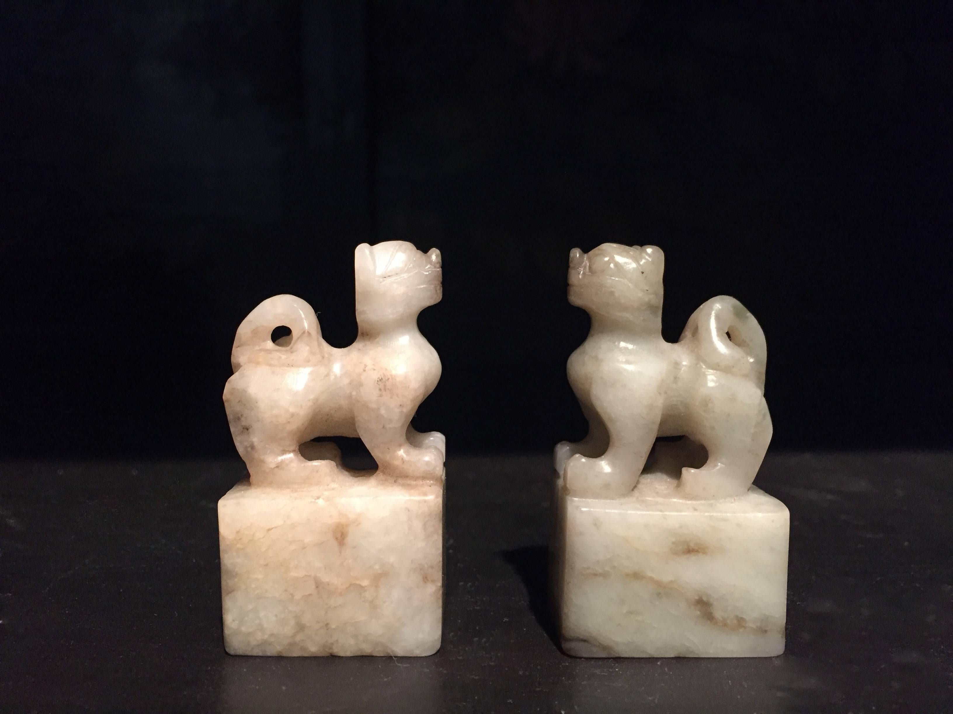 A pair of very rare 19th century He Tian jade chops featuring carved foo dog lions. The He Tian Jade, from Xin Jiang province of Western China, is the most valuable white Jade in the world. He Tian jade with the 