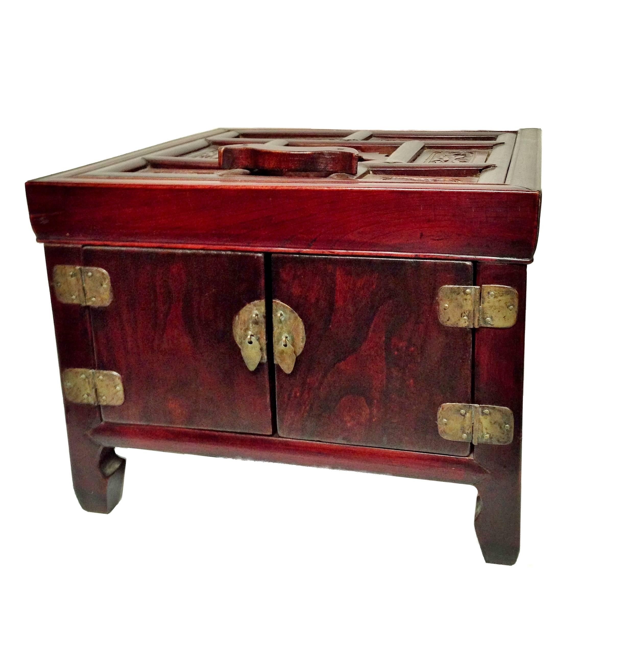 Beautiful solid elm wood was carefully chosen for the making of this special jewelry box. Box opens to reveal 3 full length drawers for storage and a mirror stand. Wonderful carvings of flowers symbolize happiness. 20" high when mirror stand is