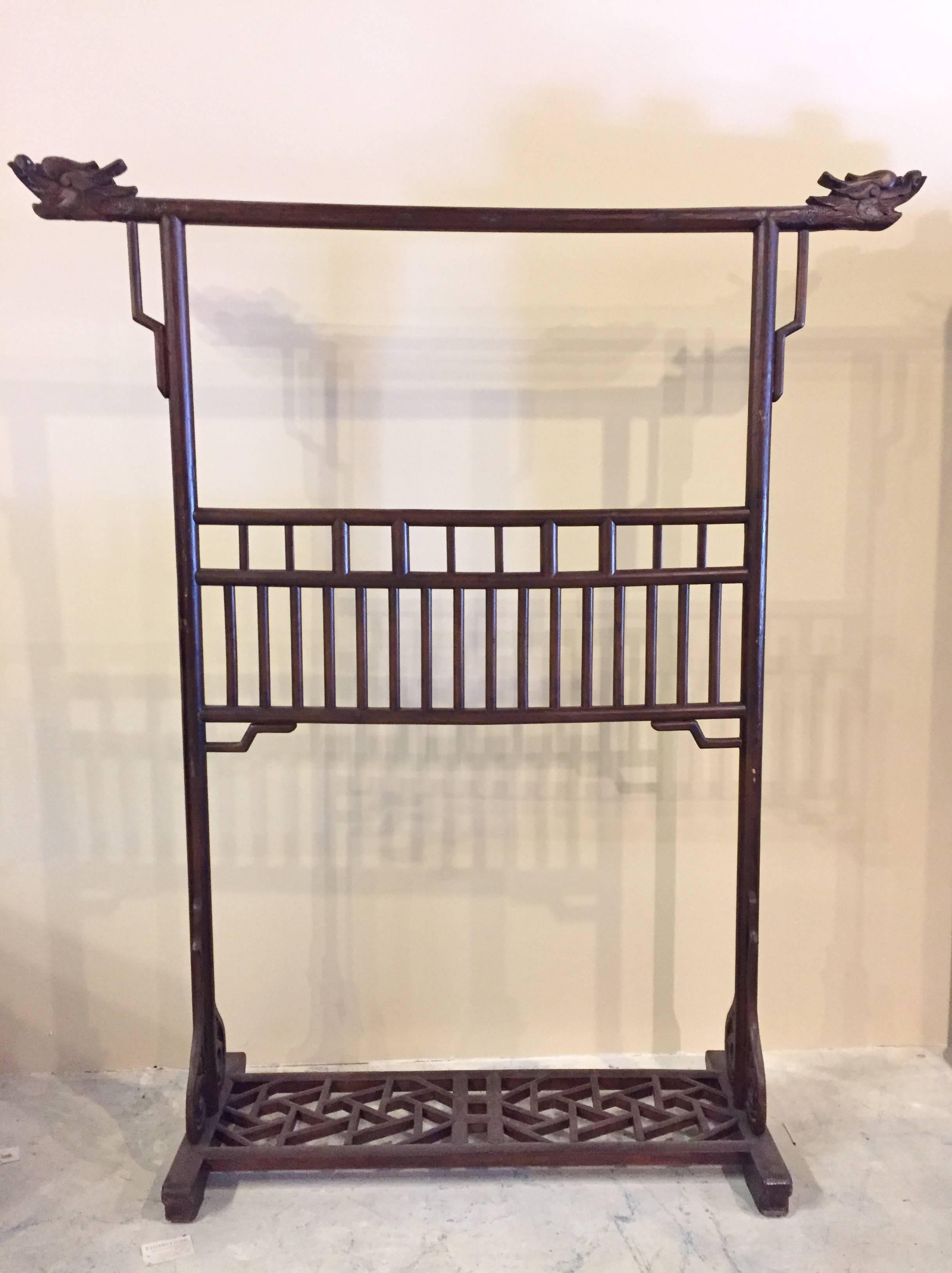 The garment rack is an unique piece of furniture used by the Chinese noblemen. Typically placed in a bedroom, it holds the robes they wear. 

This piece is very large. Standing at an impressive 6.5' tall, it belonged to an important imperial
