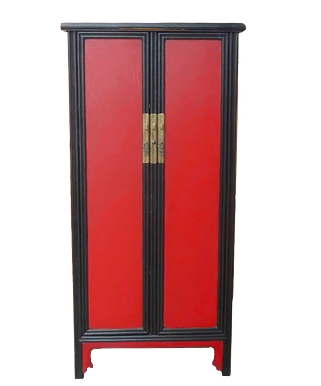 This beautiful cabinet is a great example of Ming Dynasty's simple and elegant furniture design. Contrasting red and black color makes it a fantastic focal point. Removable centre bar makes storing large items a breeze. Ample storage is provided by