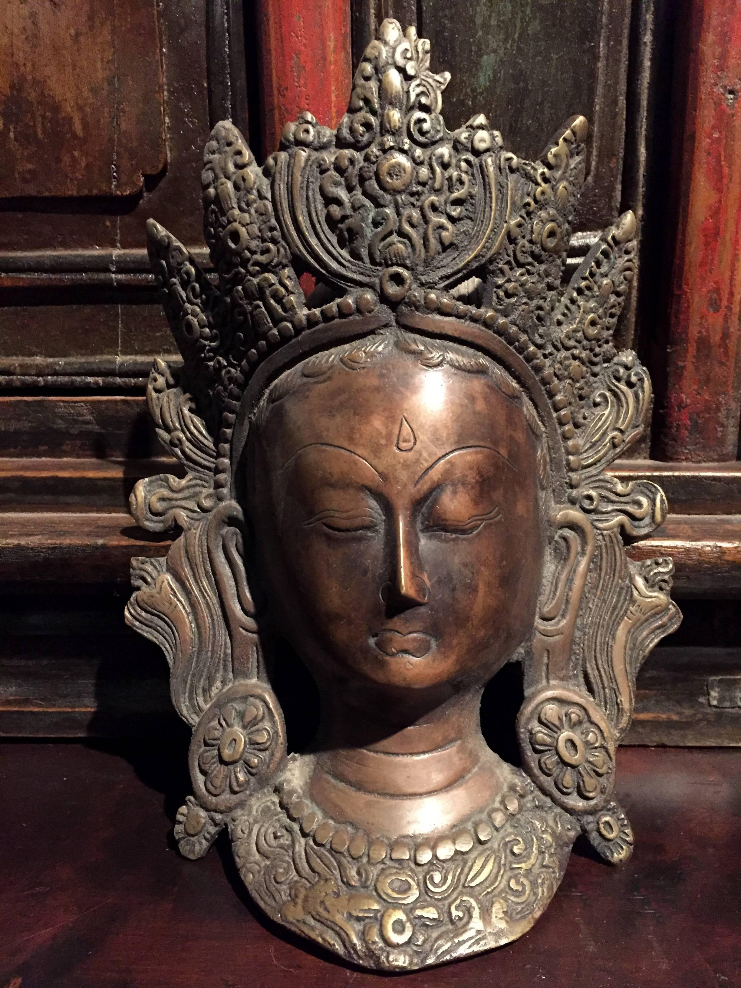 The Tara is a Tibetan Goddess of Compassion. This wonderful bronze sculpture depicts the deity in the most serene state of her presence. Such emotion is expressed through the definition of nose, elevated eyebrows, closed eyes and pursed lips. The