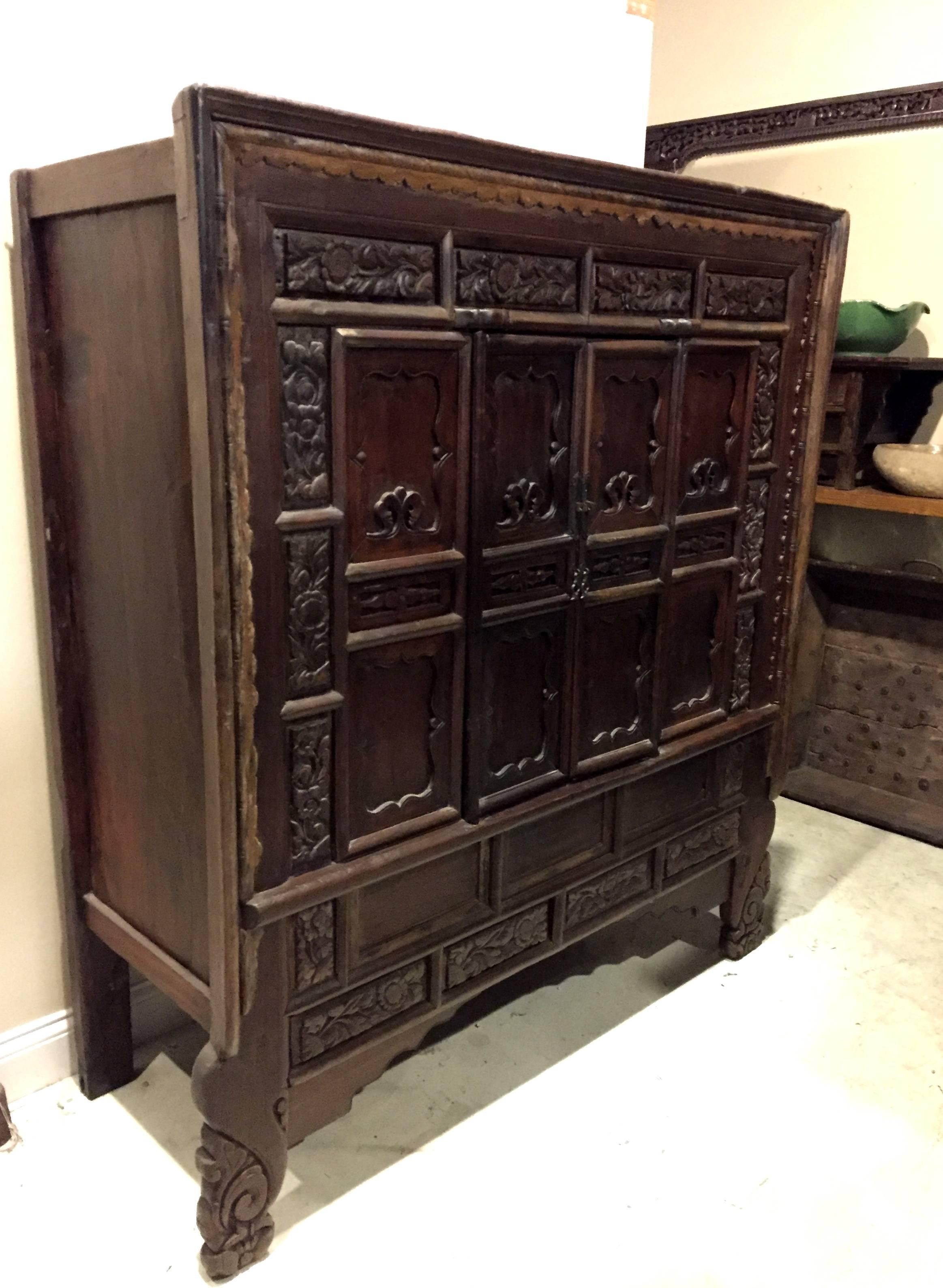 This massive cabinet is from Shanxi province, China's ancient frontier and trade post. Commanding at over 5' wide with solid structure and bold features, this exceptional piece demonstrates all the trademarks of northern Chinese furniture. The front
