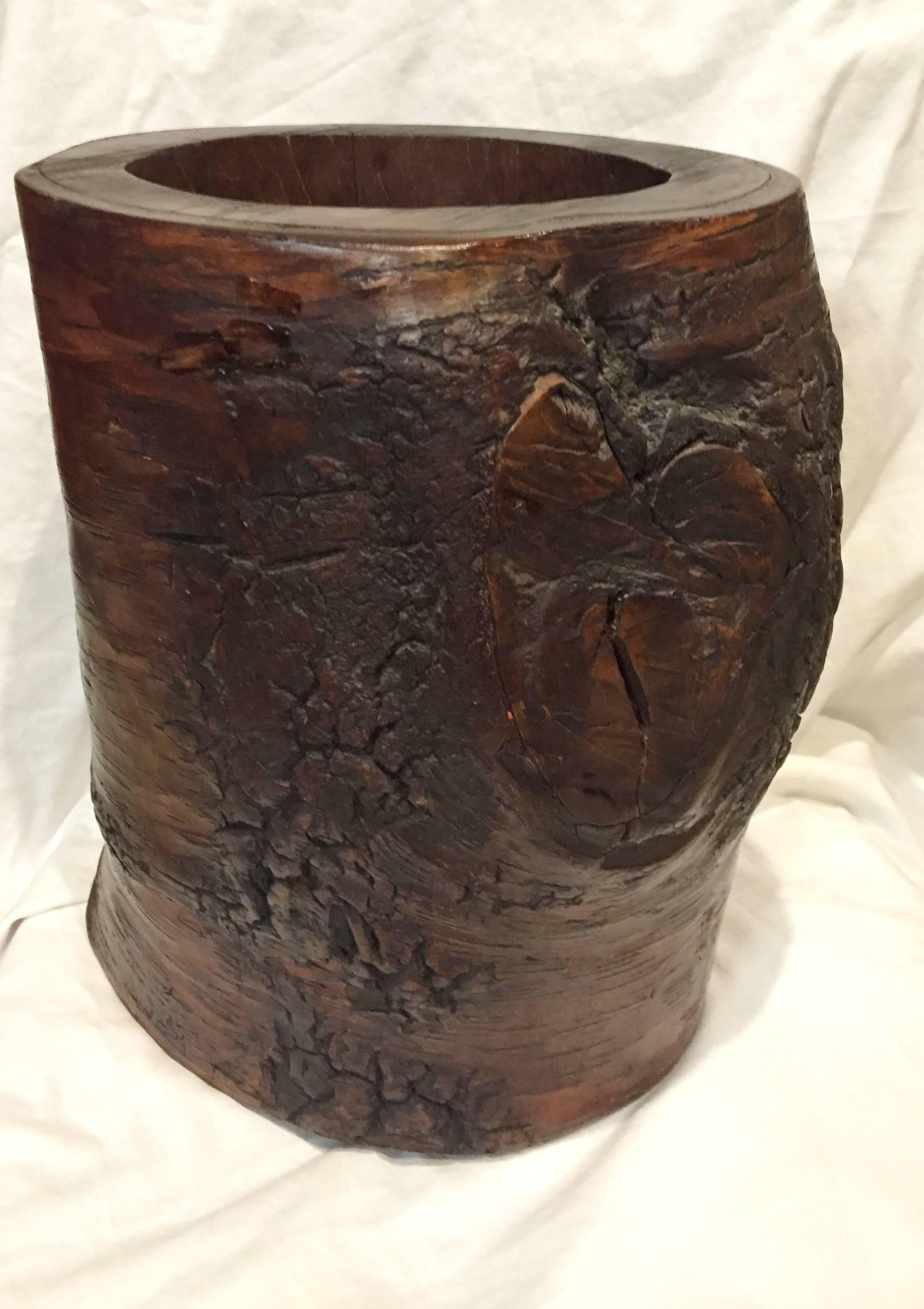 Amazing solid jujube tree stump hollowed to form an organic brush holder or a planter/vase.

The piece is substantial, very heavy and all natural. It works perfectly in many decors. With or without any additional materials within, this is an