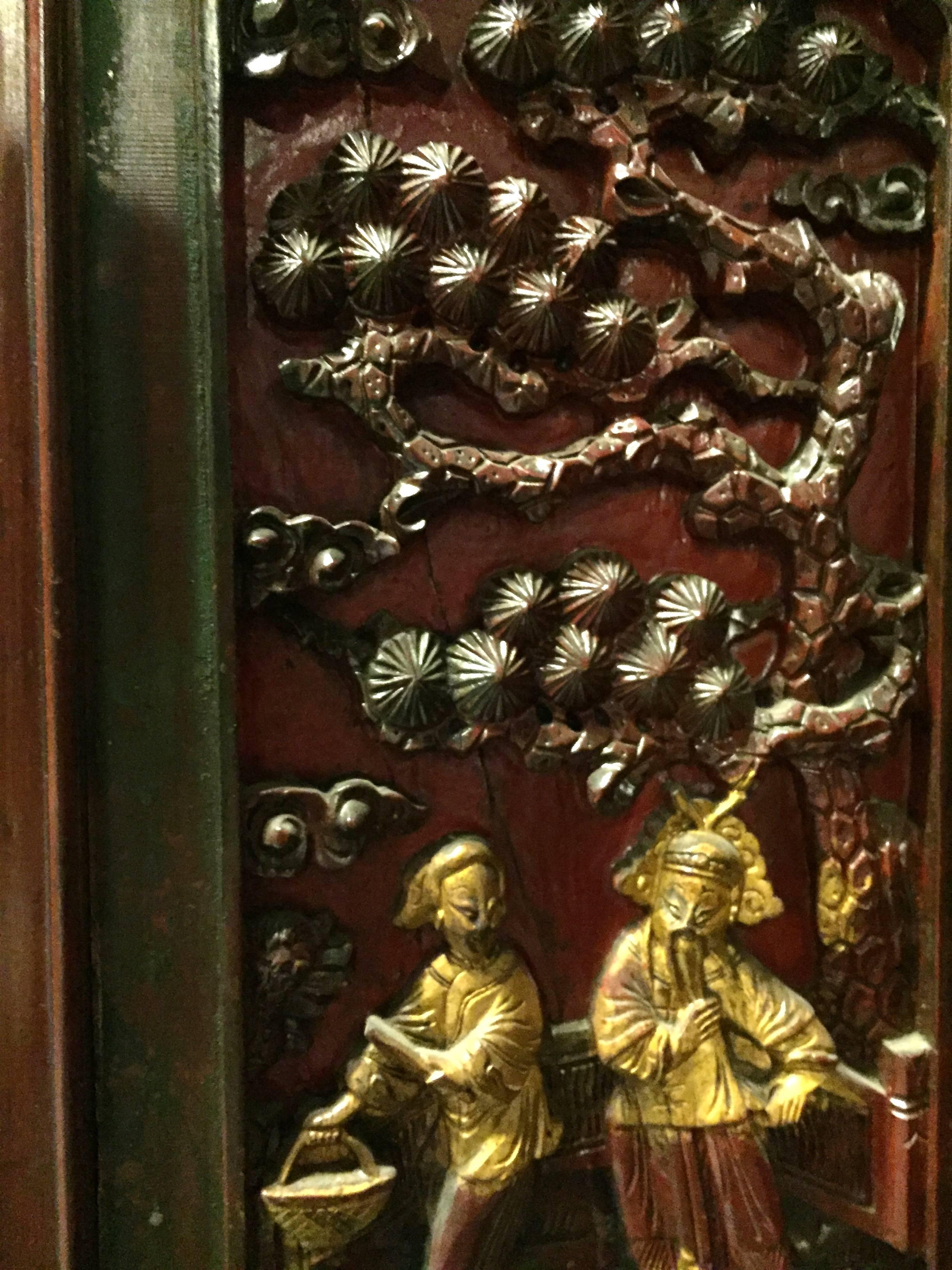 Beautiful cabinet features four finely carved panels depicting a courting couple. Mother-of-pearl encrusted frameworks and gilded figures highlight the theme. Carved butterflies decorate the corners of the cabinet with more butterflies repeated on